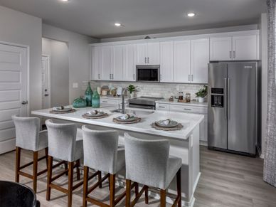 Prepare meals while kids finish homework on the spacious island.
