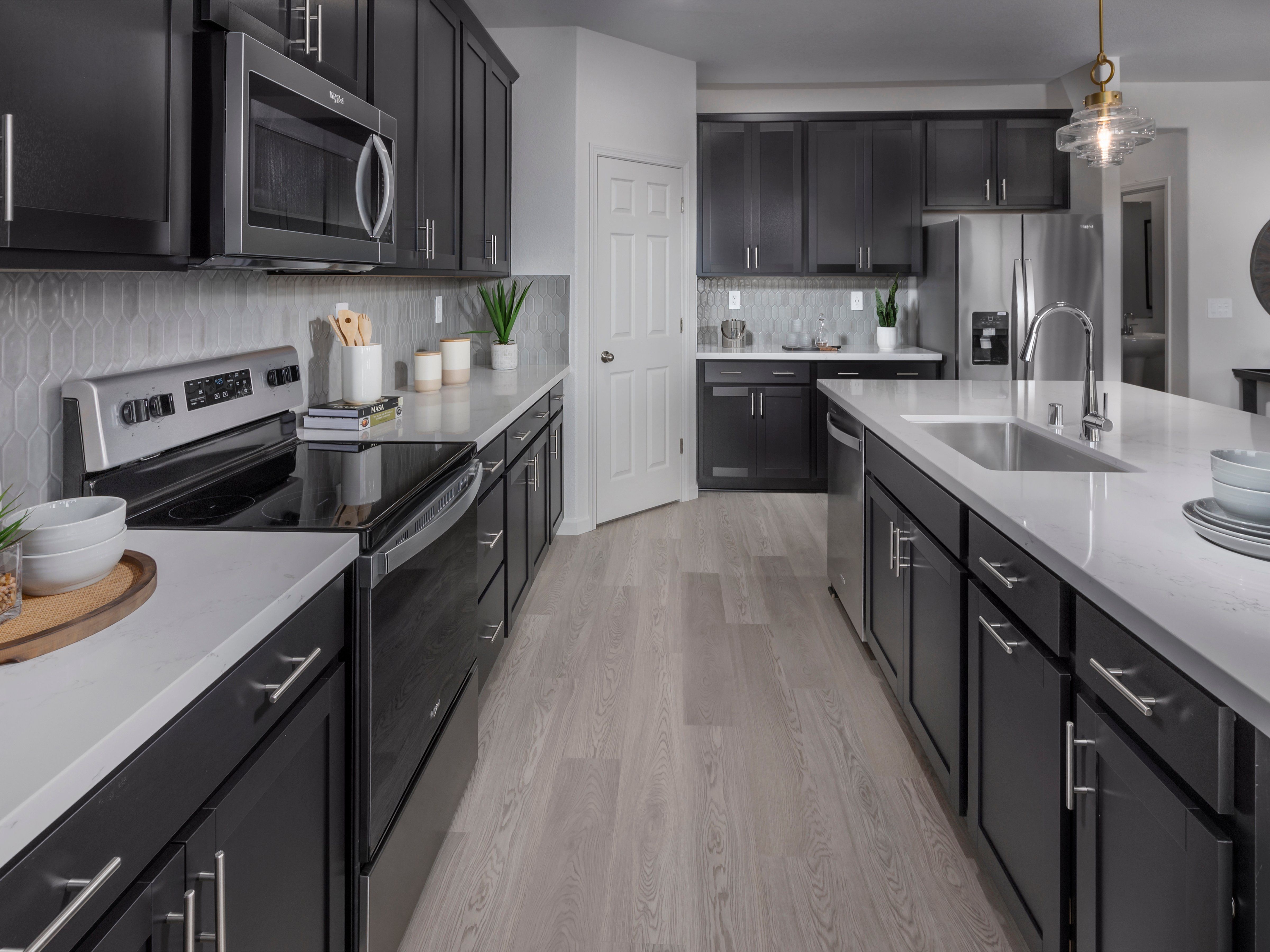 Kitchen in the 5028 floorplan at a Meritage Homes community in Manteca, CA.