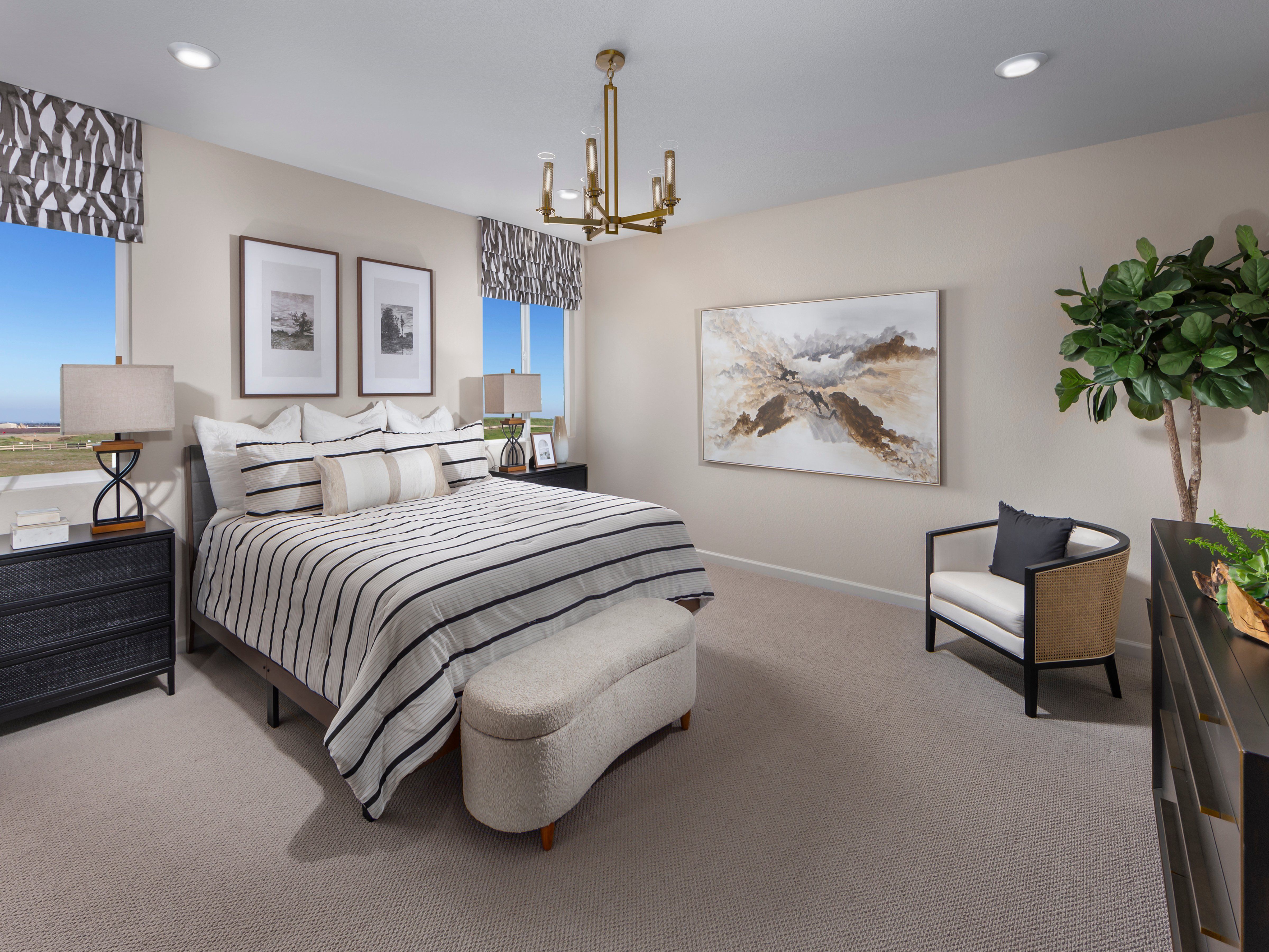 Residence 3 primary bedroom modeled at a nearby Meritage community.