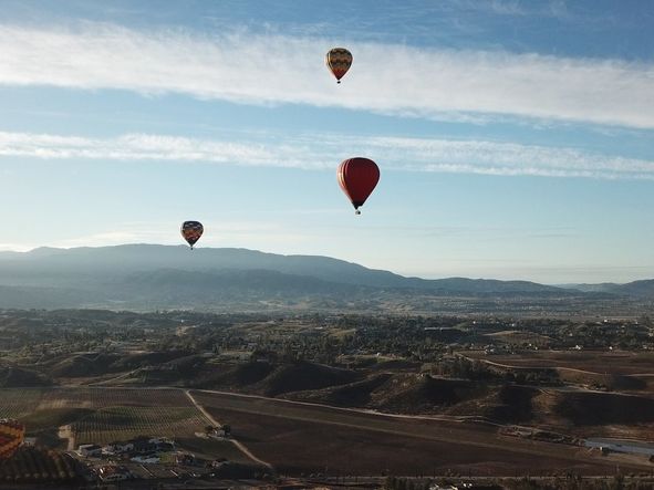 Temecula’s hot air balloon rides offer breathtaking views of the city from above.