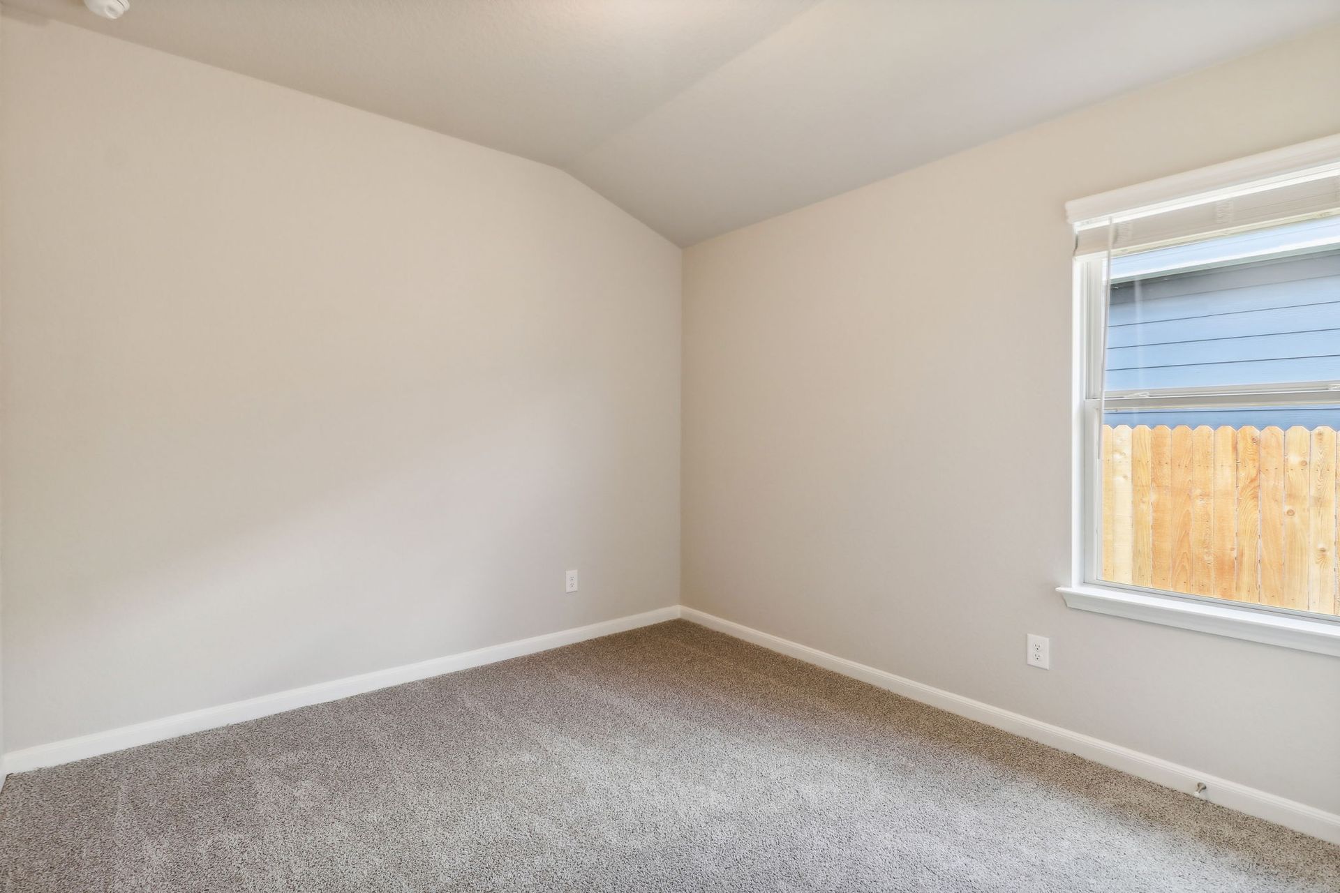 Guest bedroom in the Hughes floorplan at a Meritage Homes community.