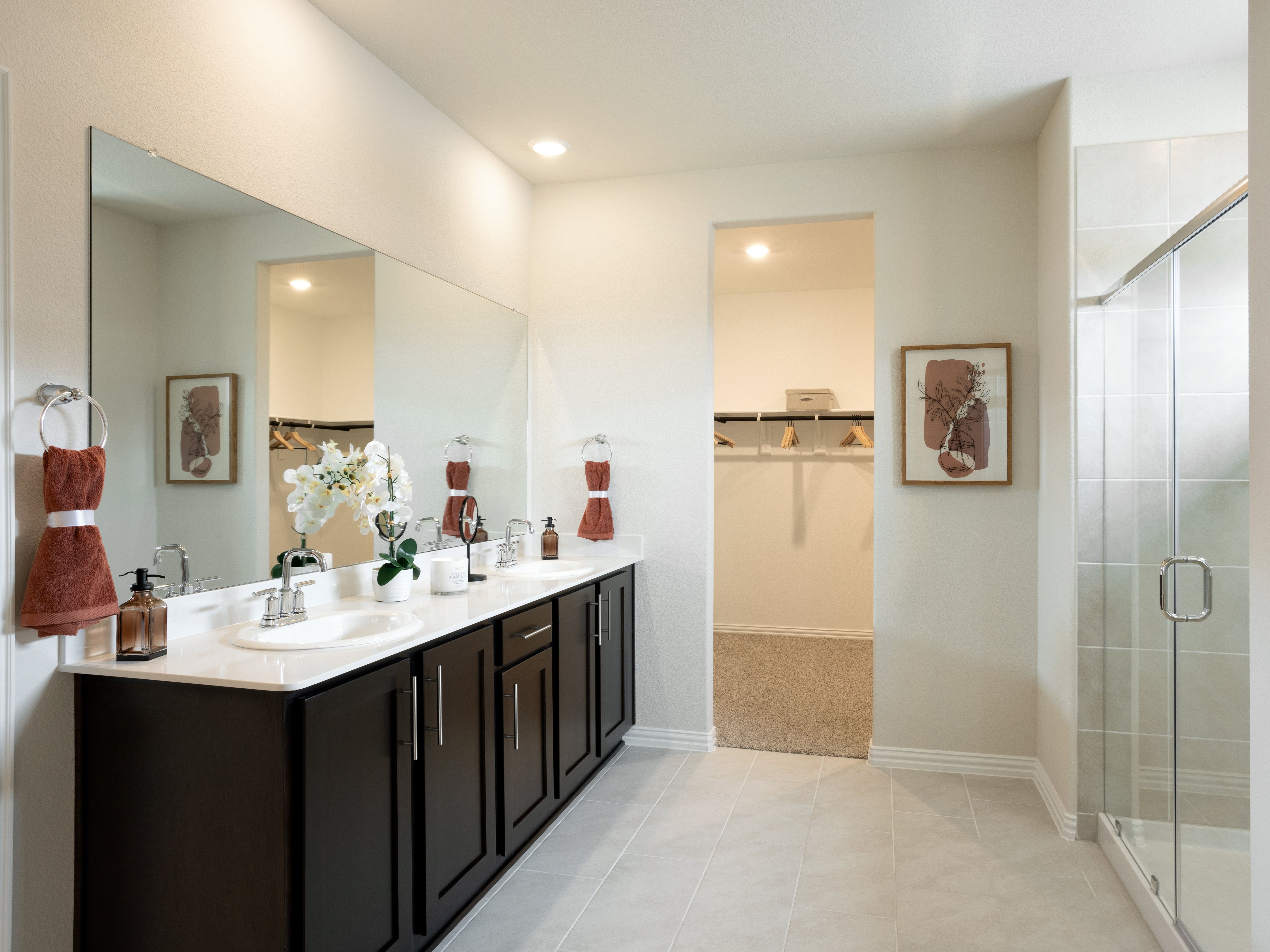 Your primary bathroom retreat features double vanities