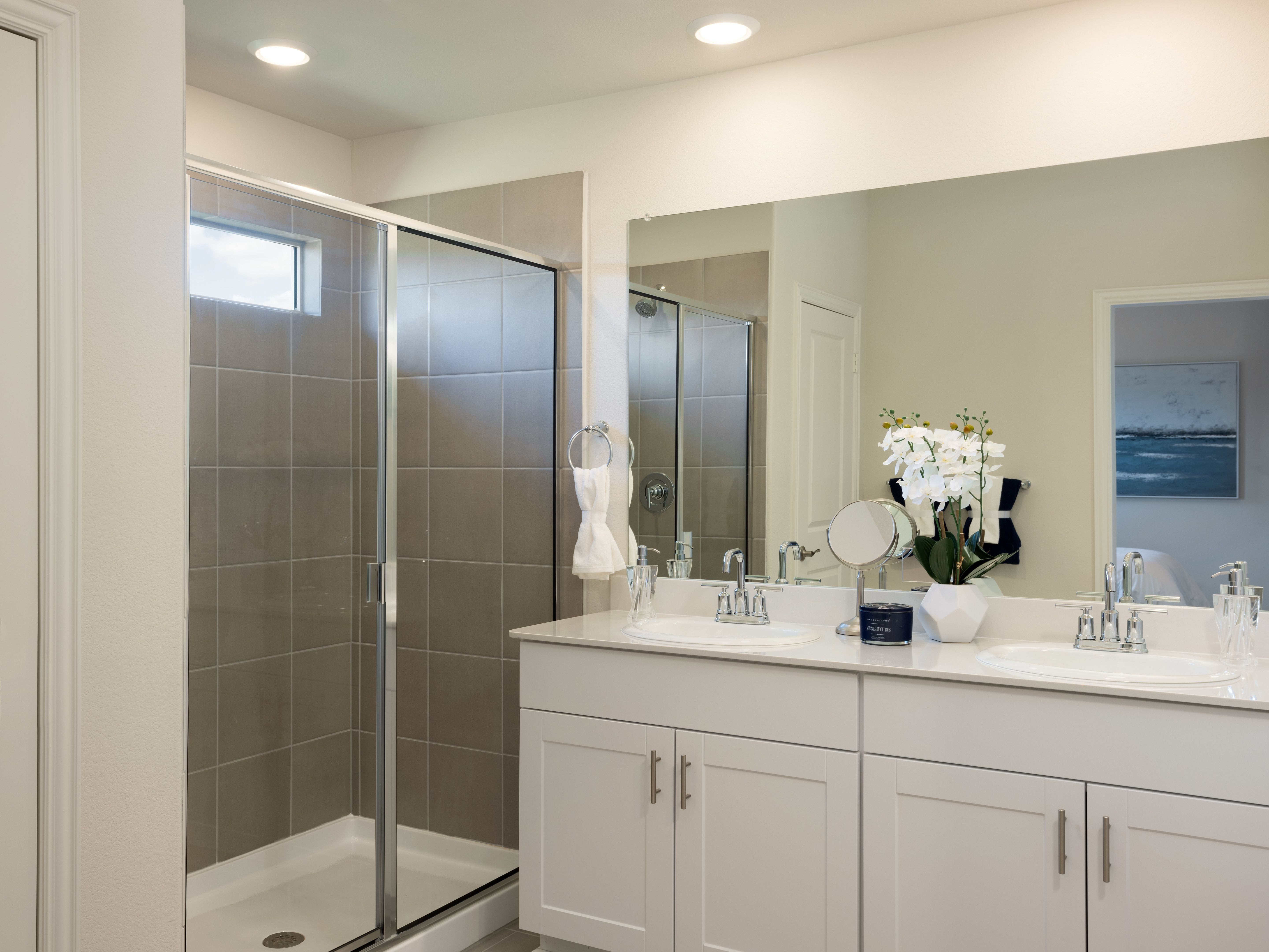 Your primary bathroom retreat features double vanities