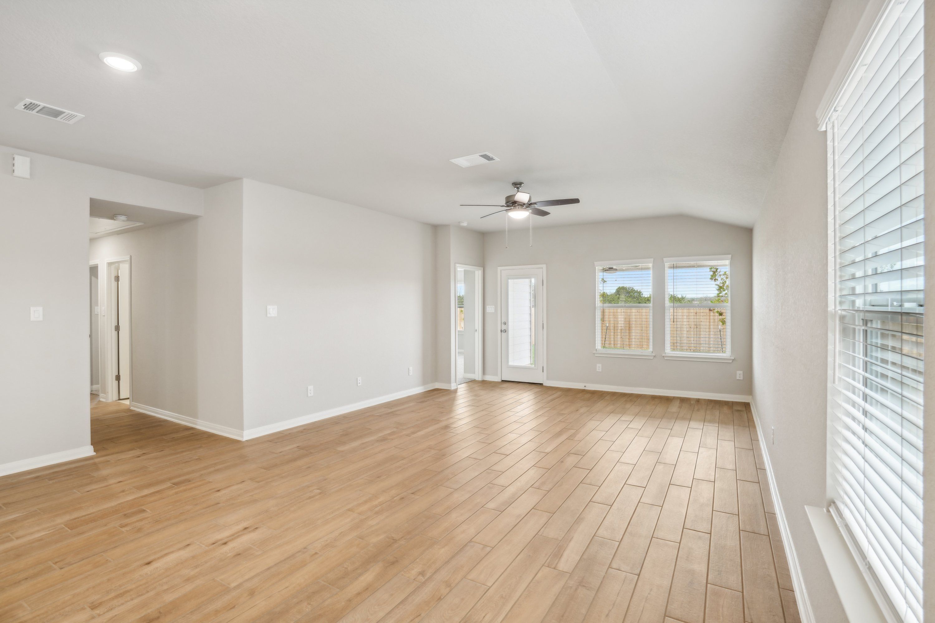 Dining room and living room in the Oleander floorplan at a Meritage Homes community.
