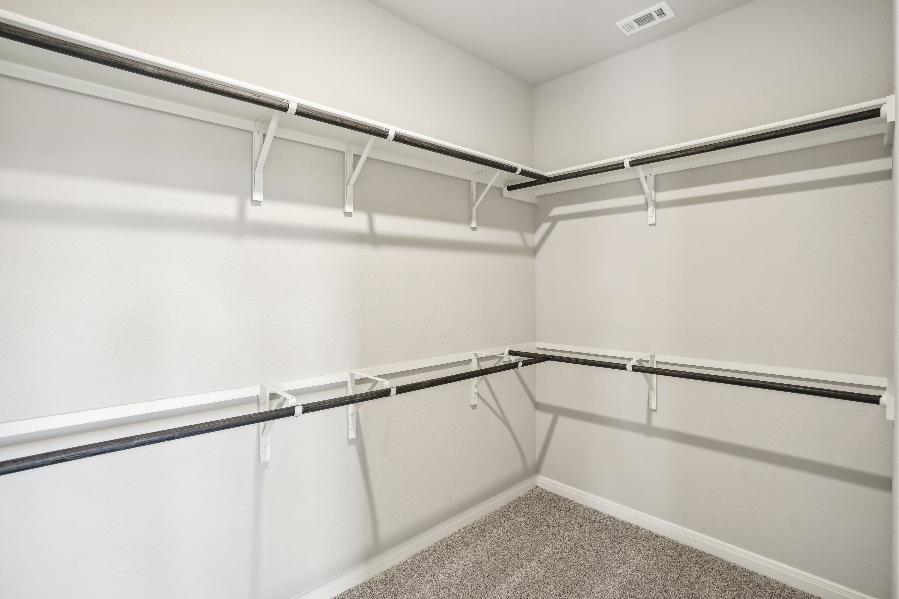 Primary suite walk-in closet in the Oleander floorplan at a Meritage Homes community.
