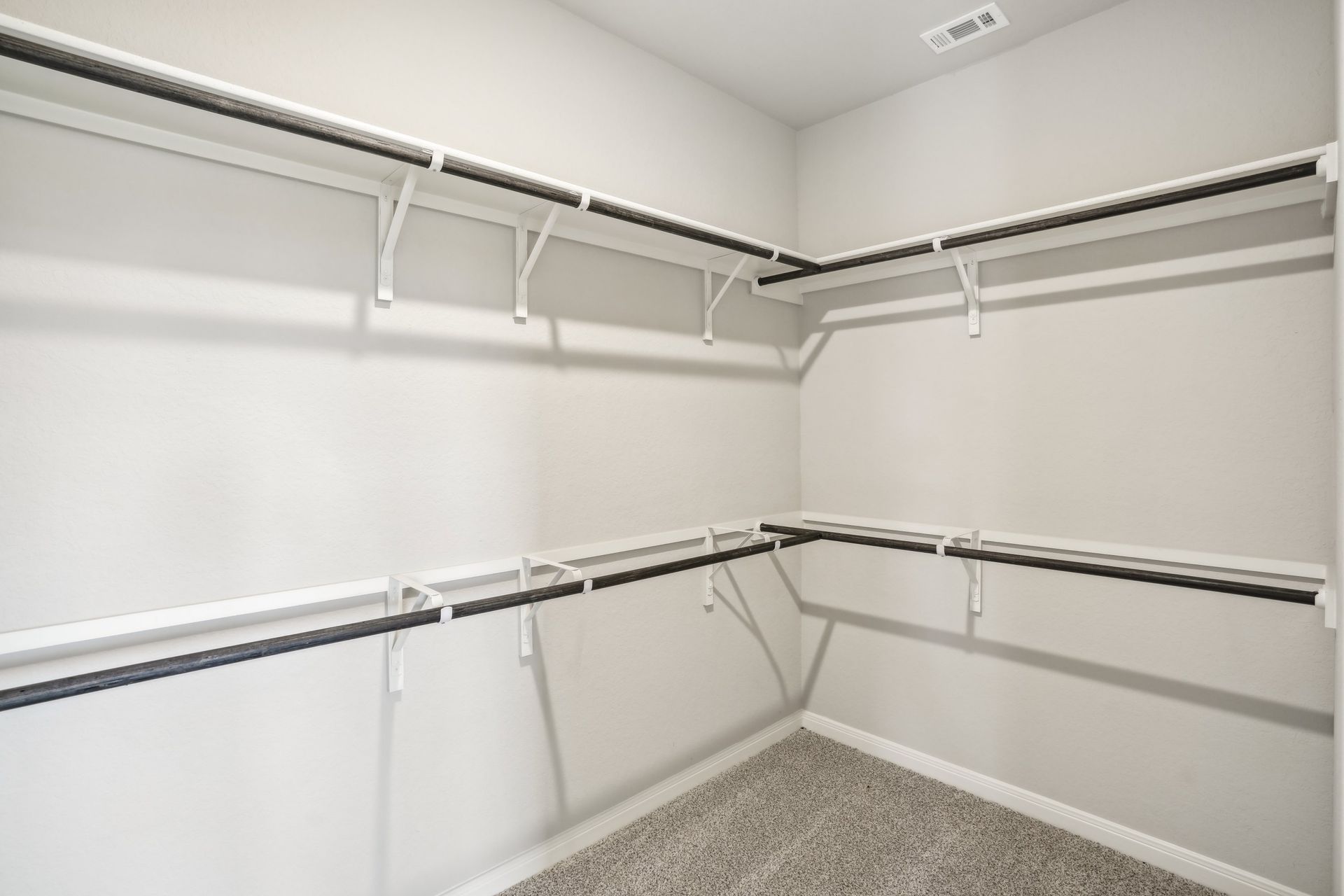 Primary suite walk-in closet in the Oleander floorplan at a Meritage Homes community.