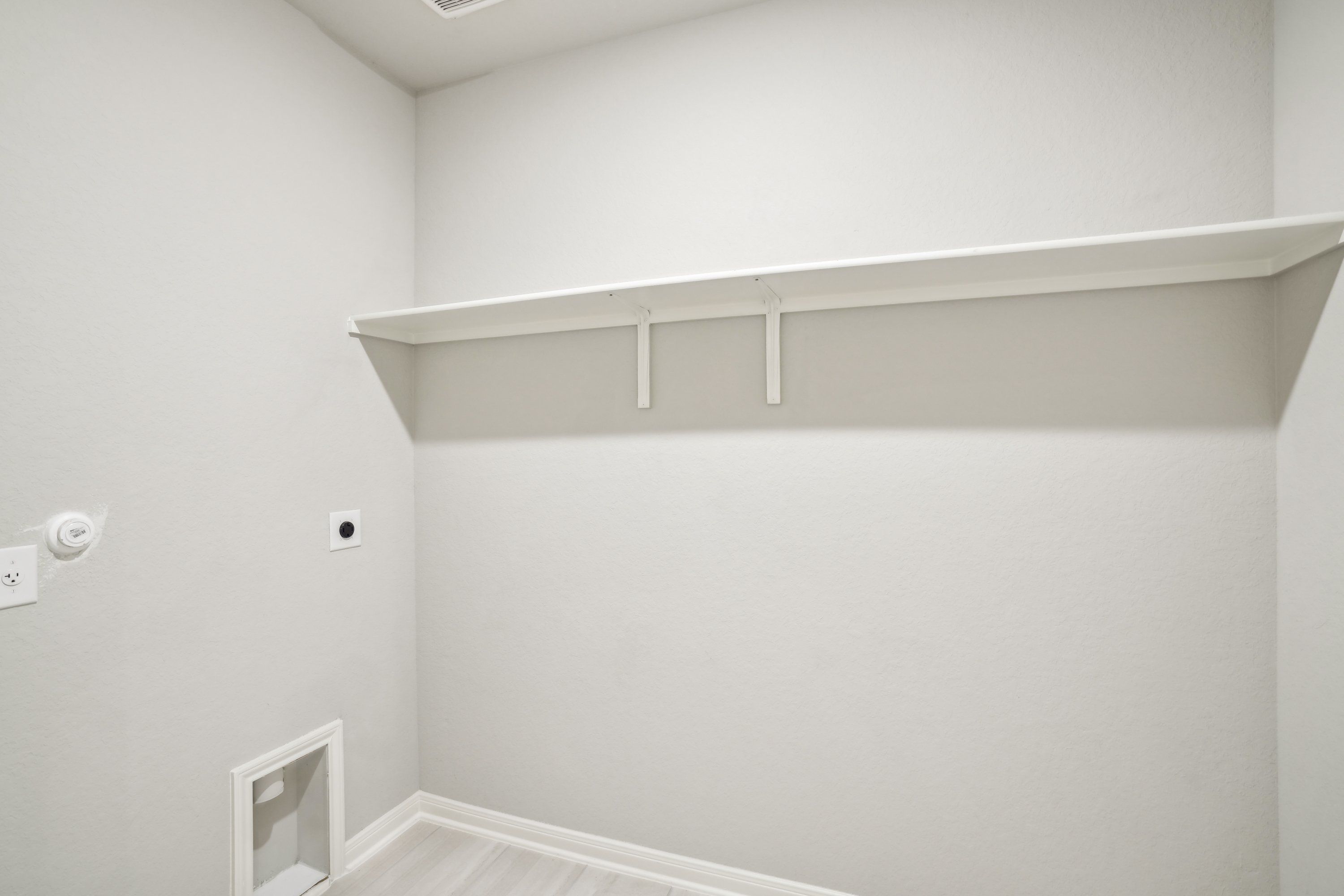 Laundry room in the Oleander floorplan at a Meritage Homes community.