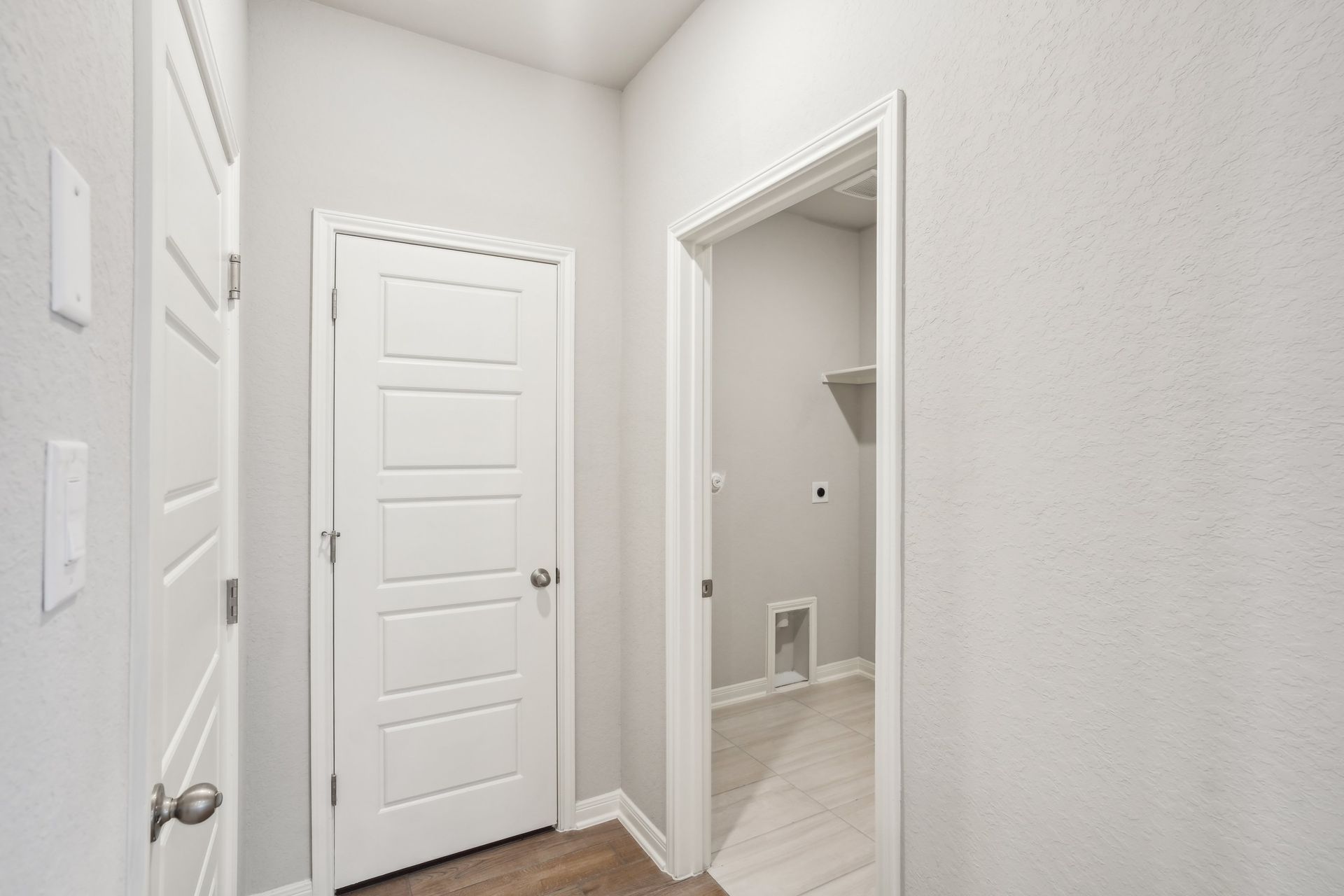 Hallway in the Oleander floorplan at a Meritage Homes community.