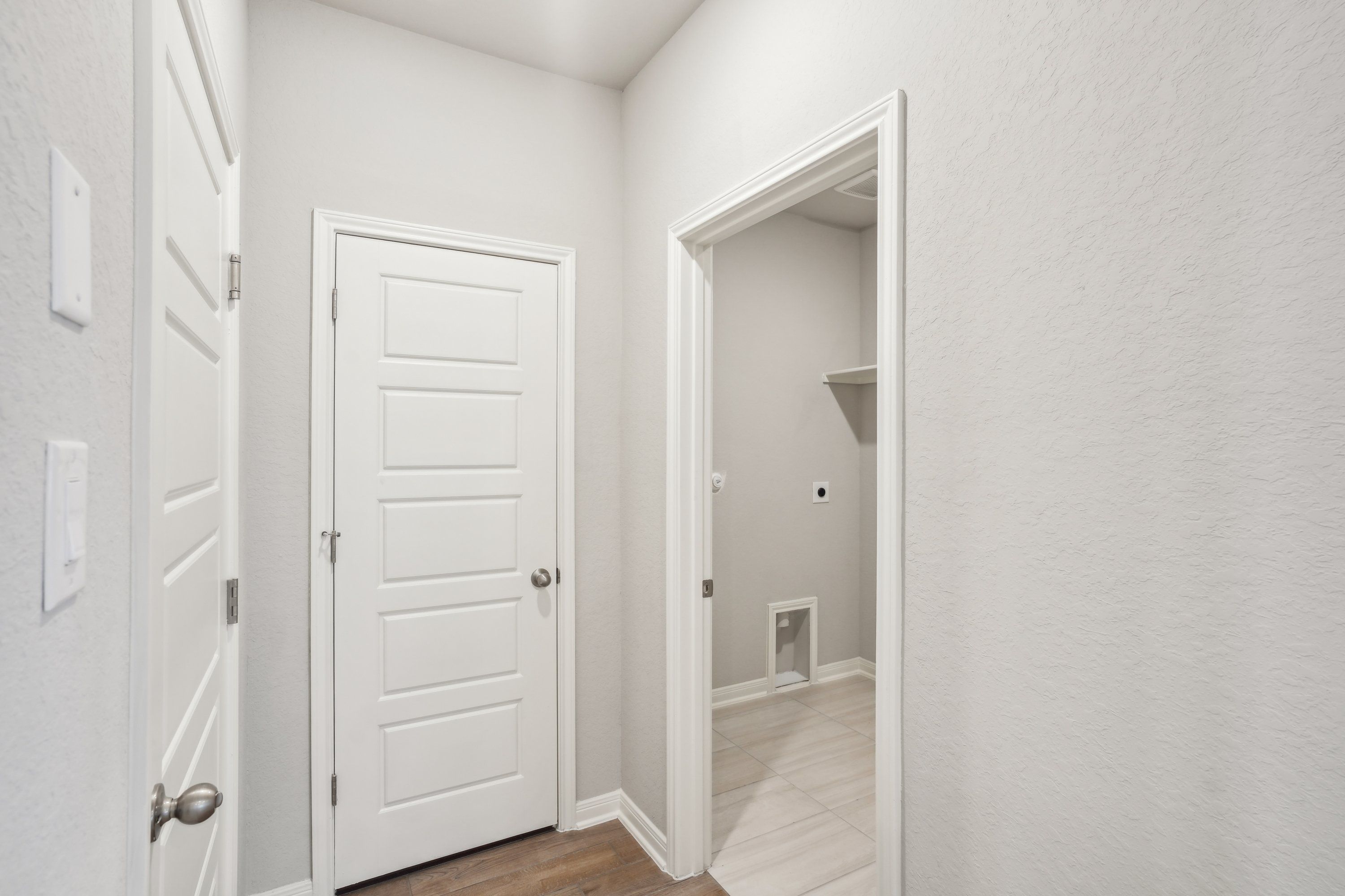 Hallway in the Oleander floorplan at a Meritage Homes community.