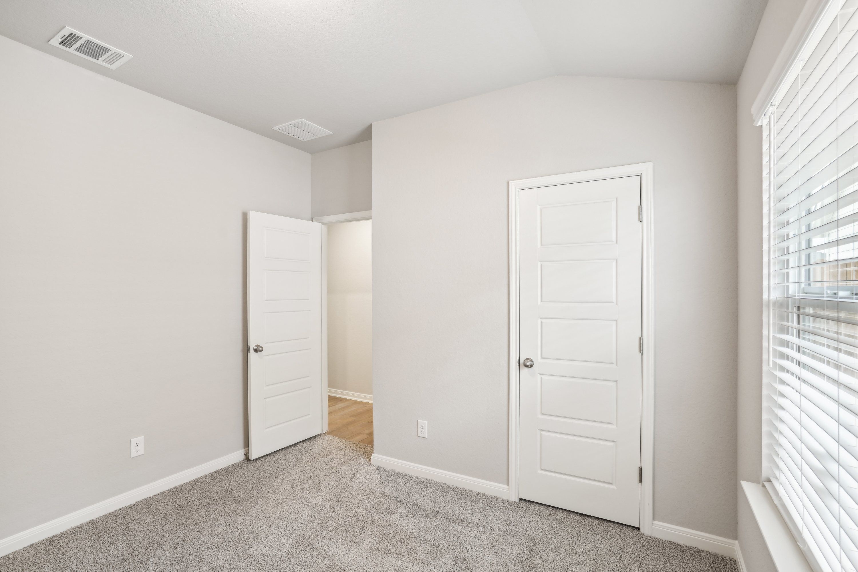 Guest bedroom in the Oleander floorplan at a Meritage Homes community.