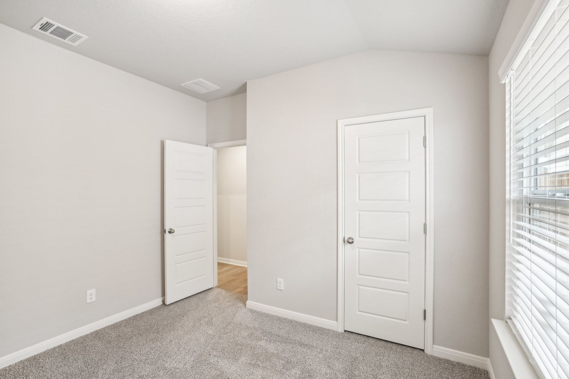 Guest bedroom in the Oleander floorplan at a Meritage Homes community.