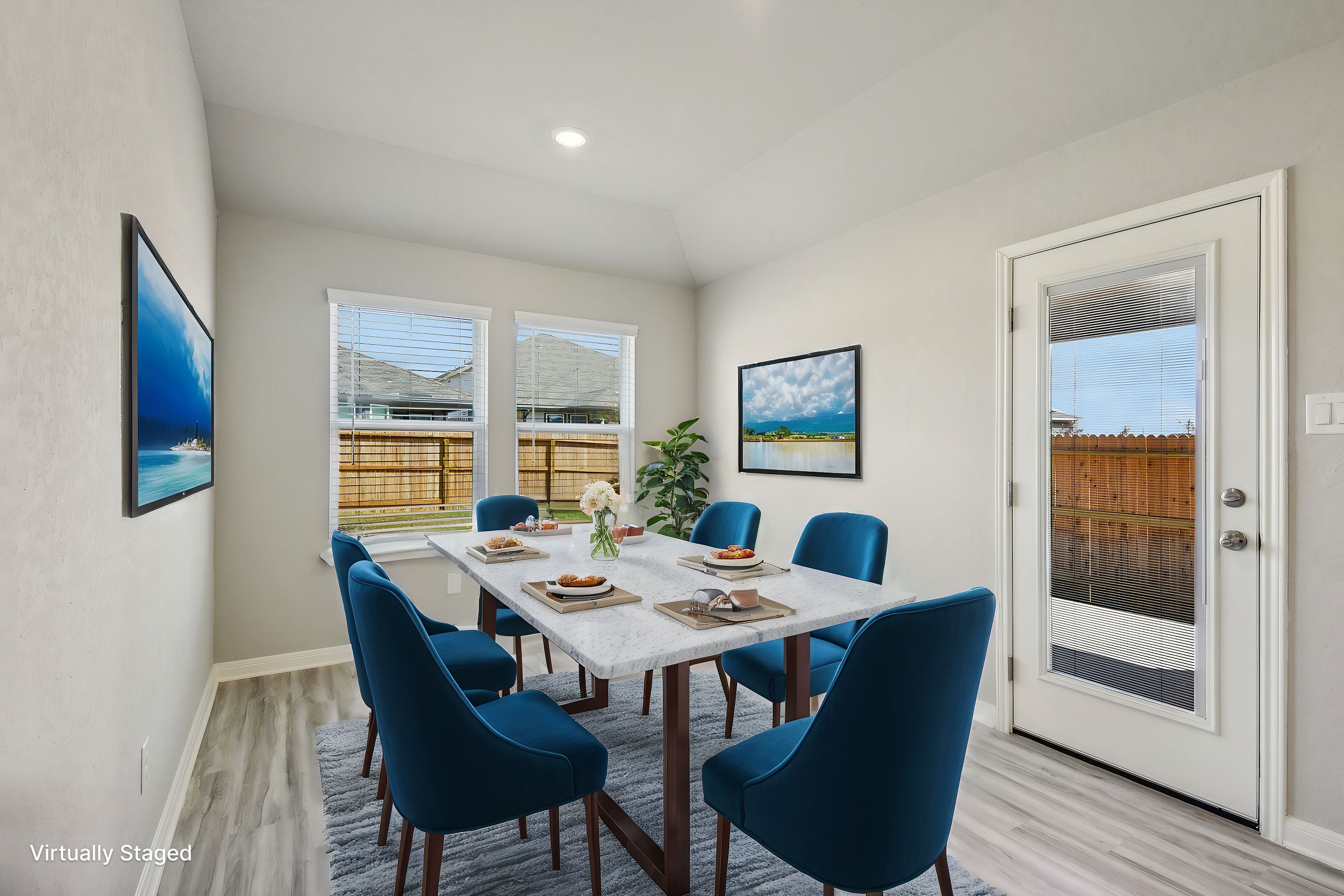 Virtually staged dining room in the Callaghan floorplan at a Meritage Homes community.
