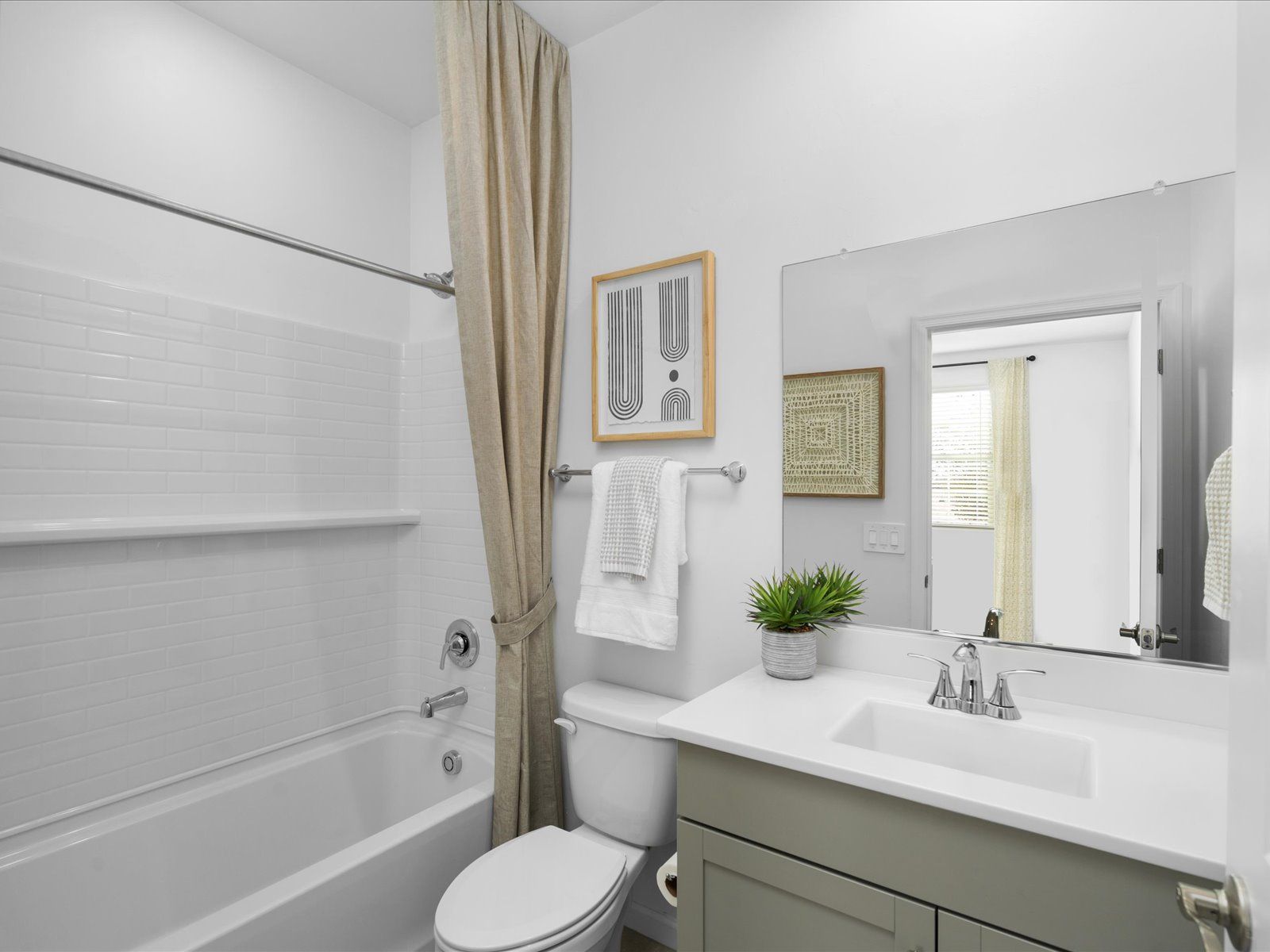 The bathroom located in bedroom 4 makes the room an ideal guest suite or office.