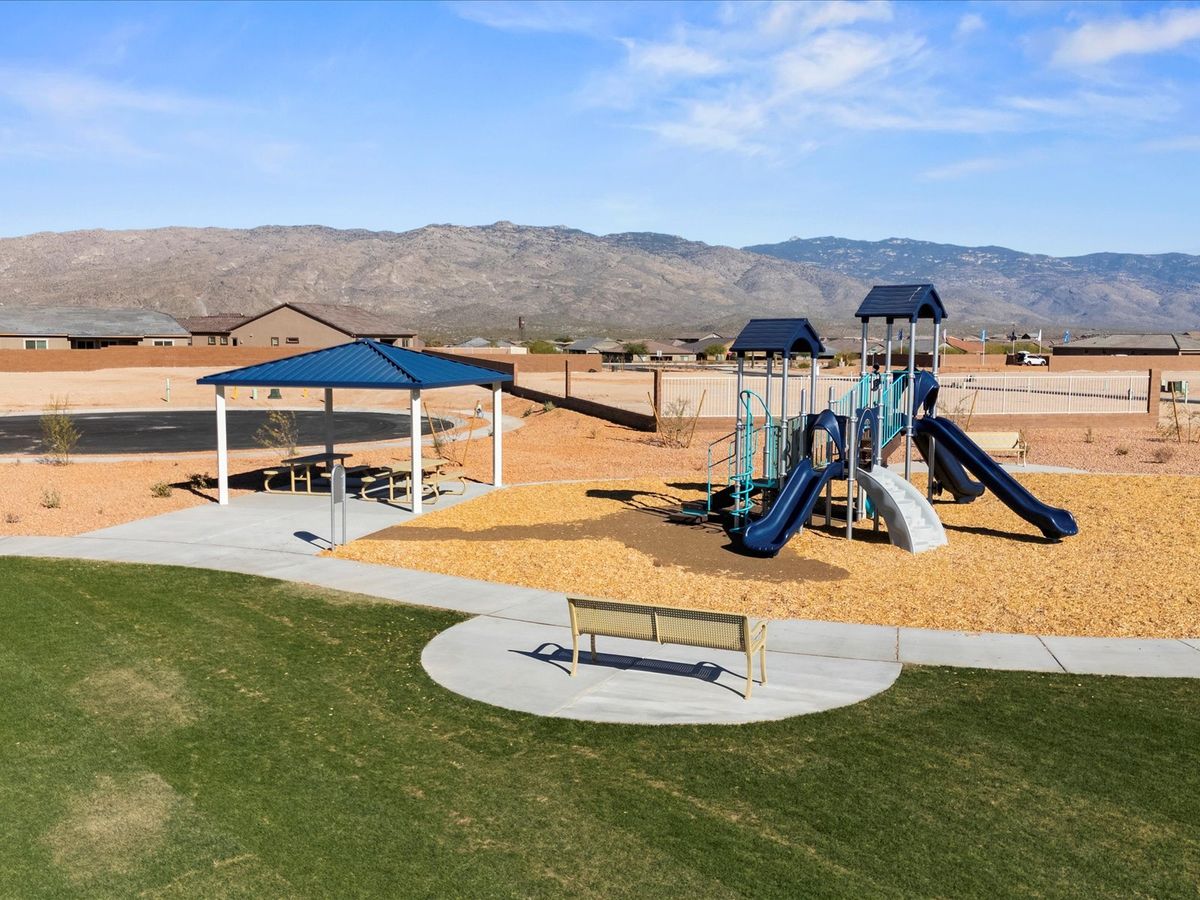 Enjoy the playground, picnic tables and grass area located within the Alamar community.