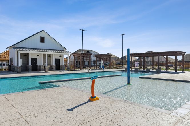 A kids splash pad attached to the resort-style pool.