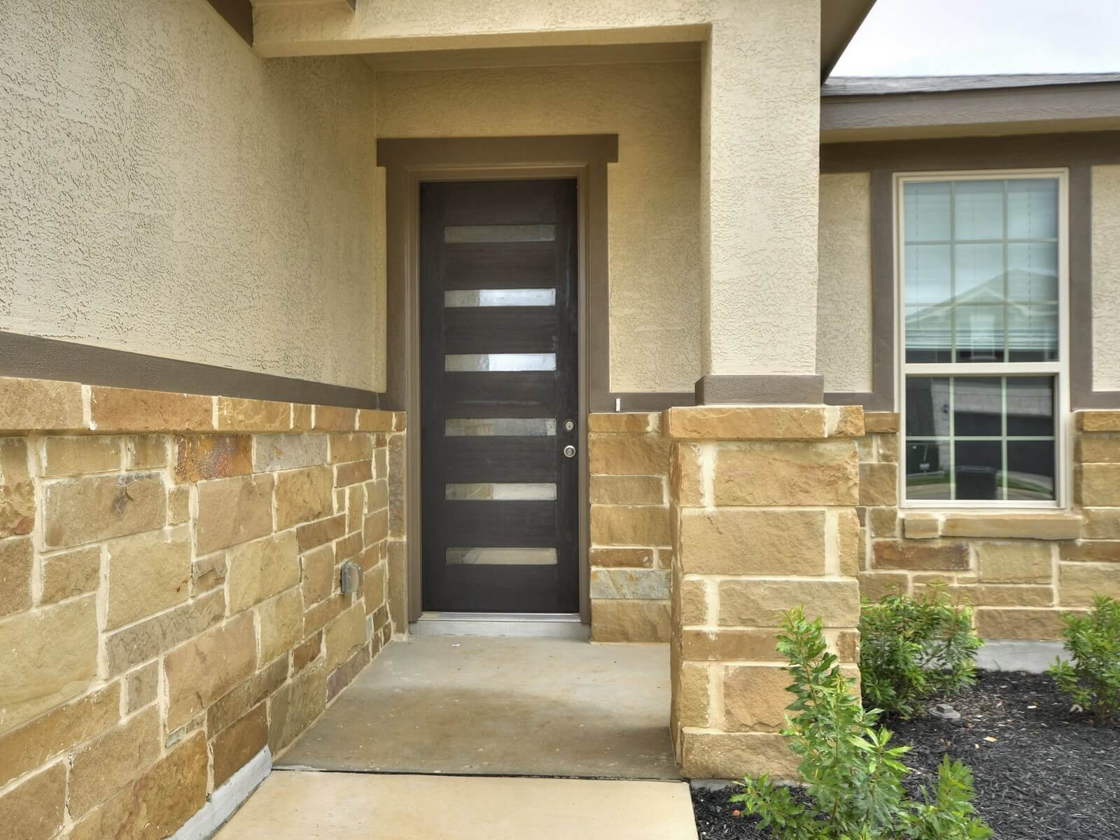 Front exterior of the San Saba floorplan at a Meritage Homes community.