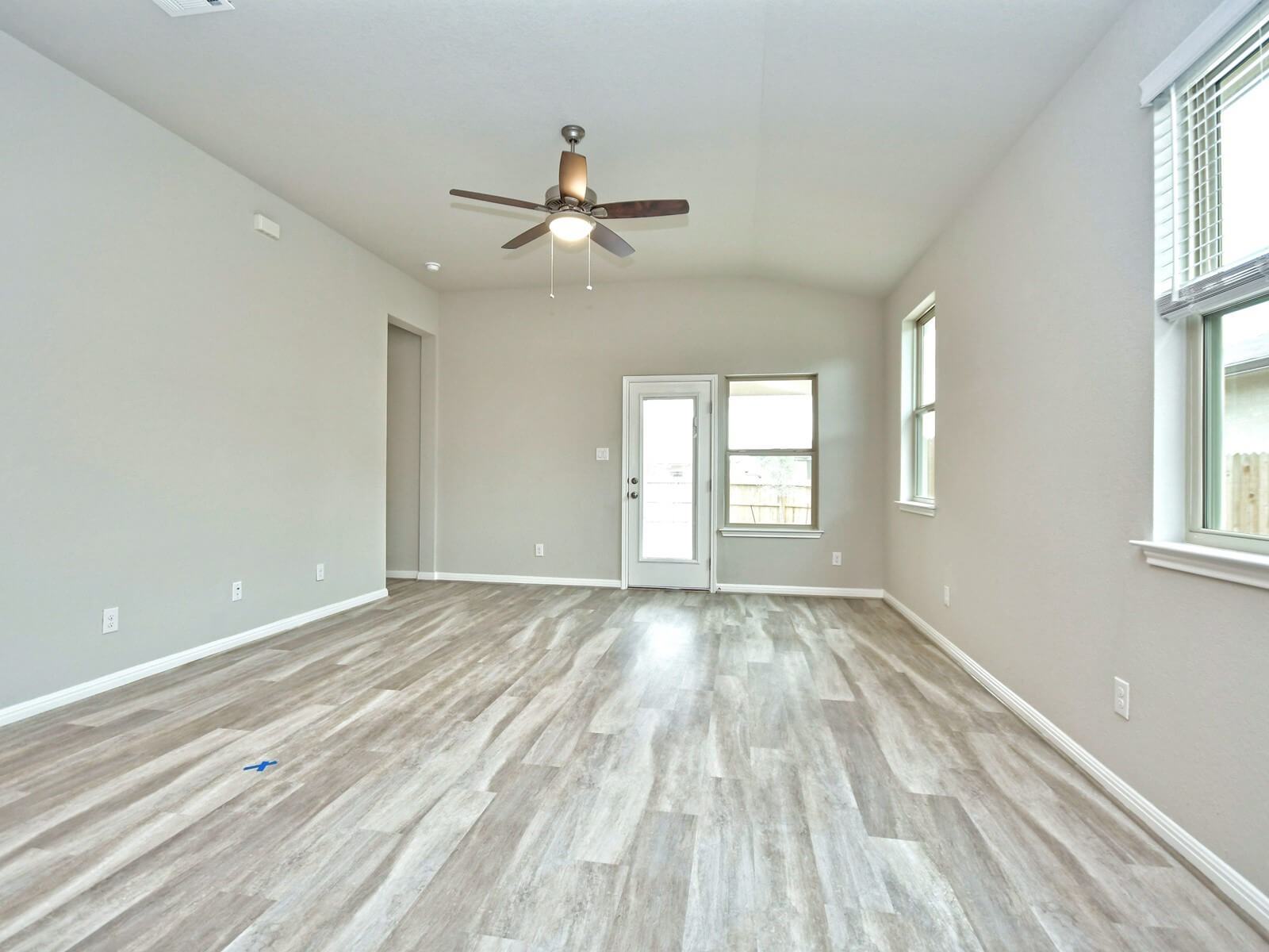 Dining and living room in the San Saba floorplan at a Meritage Homes community.