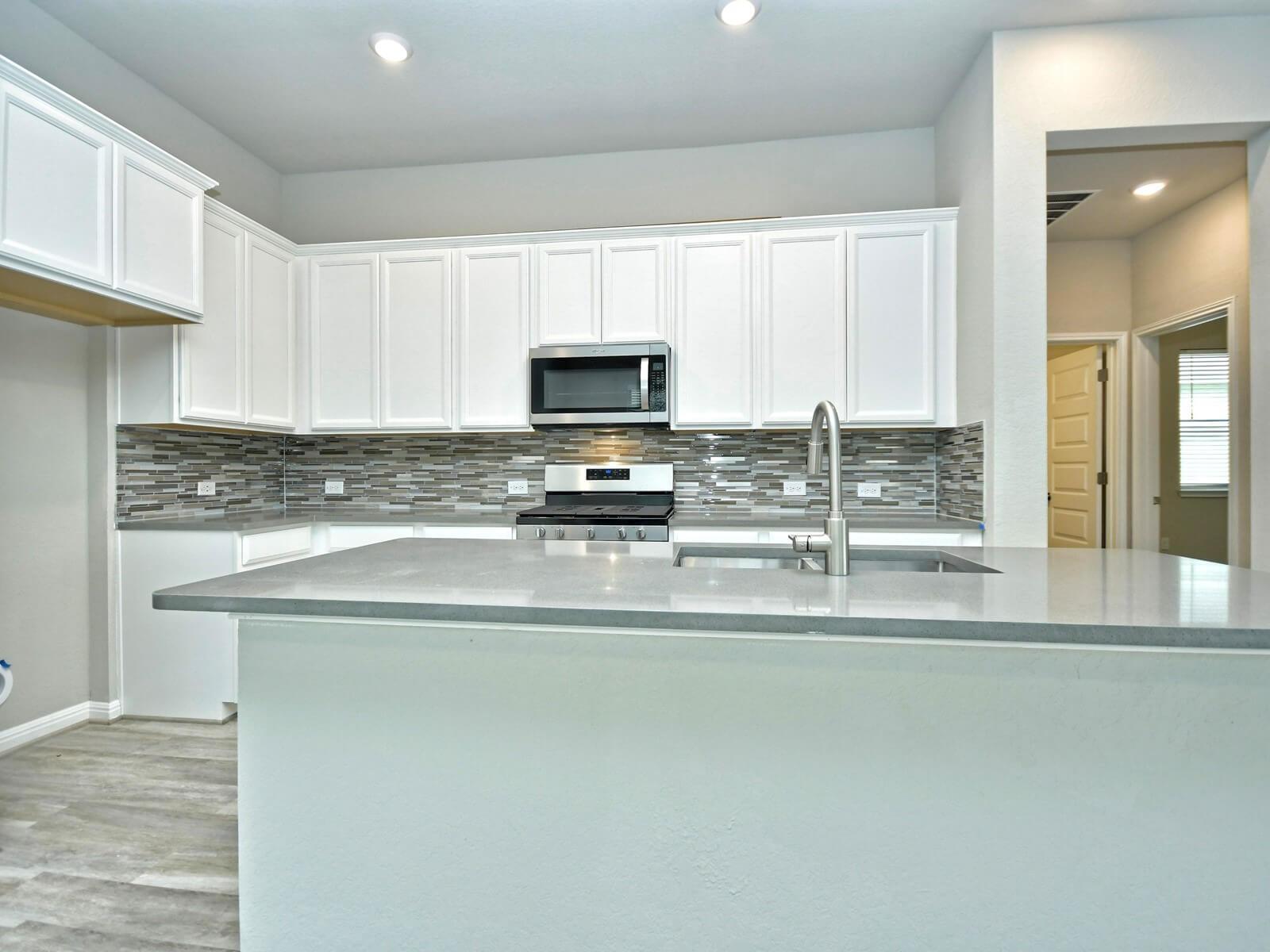 Kitchen in the San Saba floorplan at a Meritage Homes community.