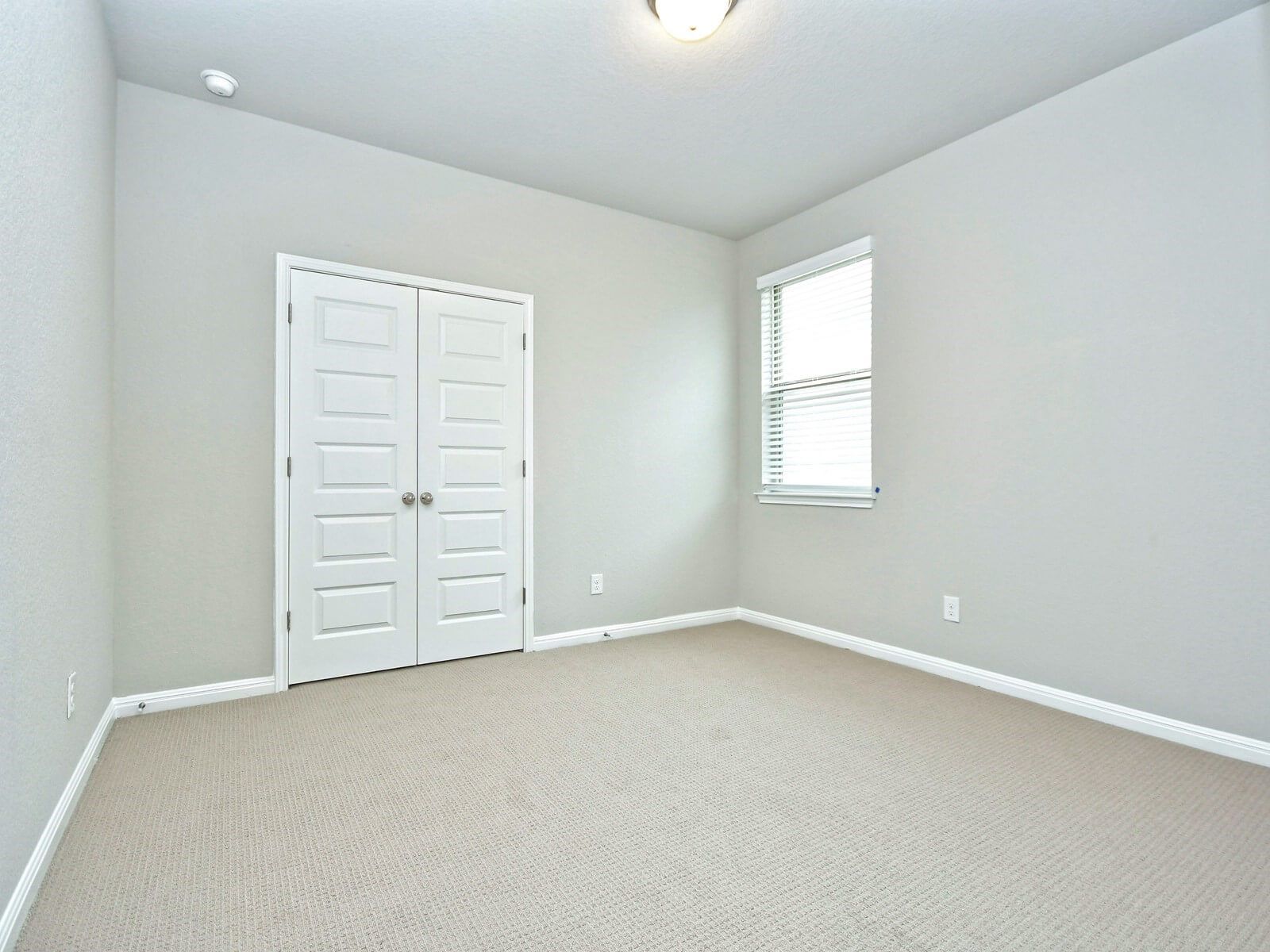 Guest bedroom in the San Saba floorplan at a Meritage Homes community.