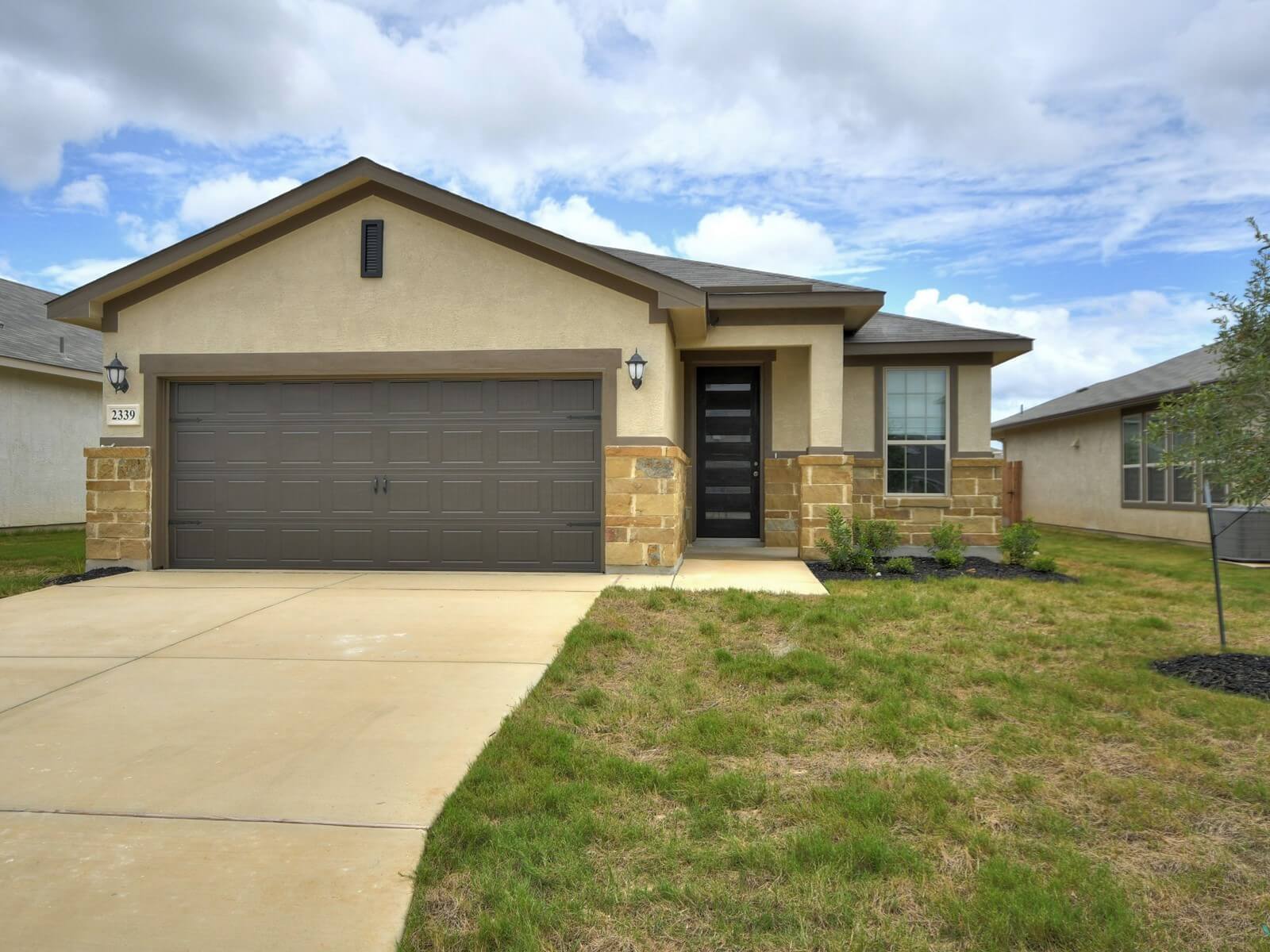 Front exterior of the San Saba floorplan at a Meritage Homes community.