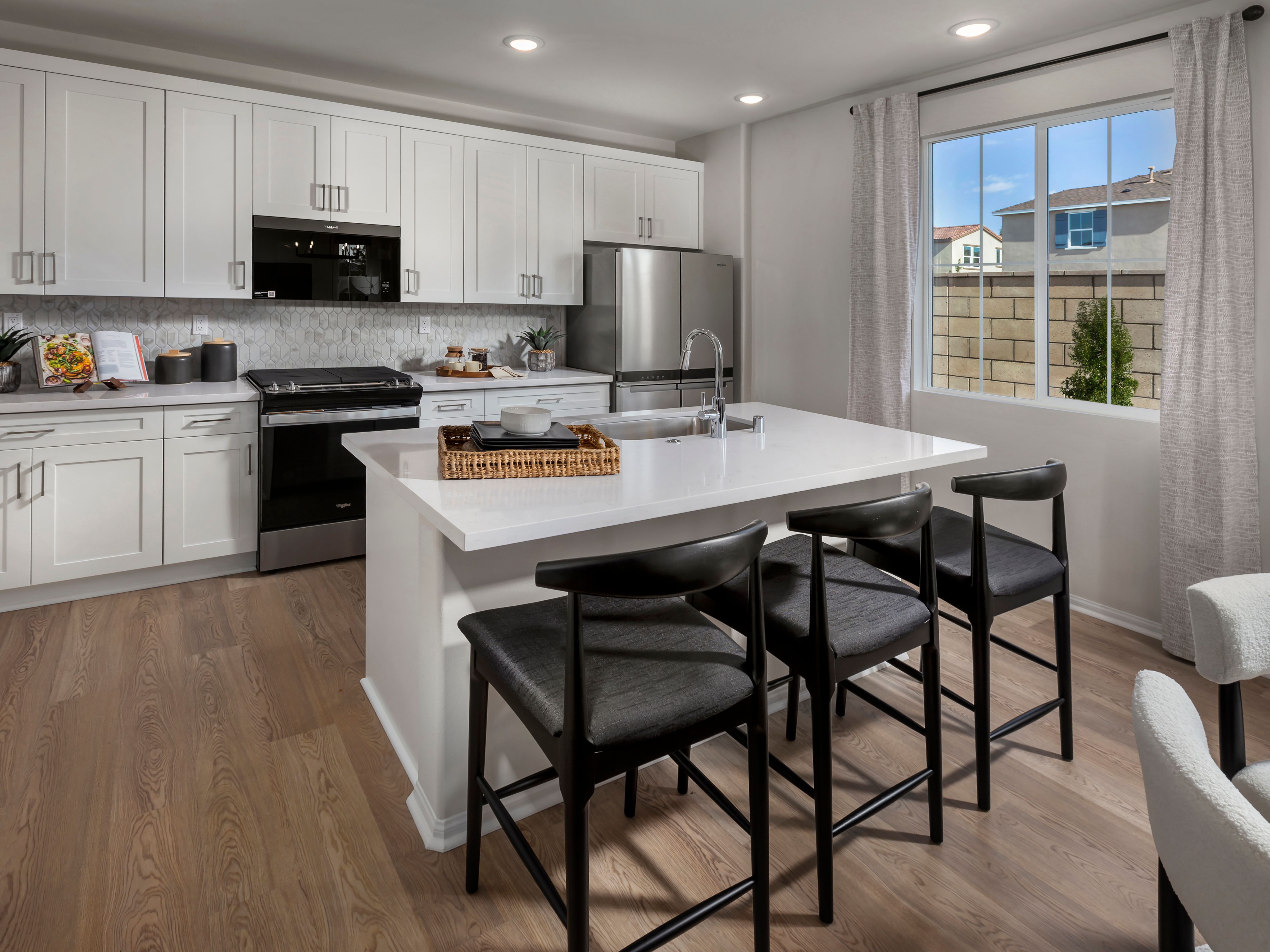 Spacious, chef-inspired kitchens fully equipped with a suite of Whirlpool® appliances.
