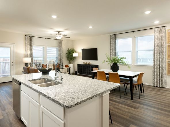 Have clear views from the kitchen into the living and dining rooms.