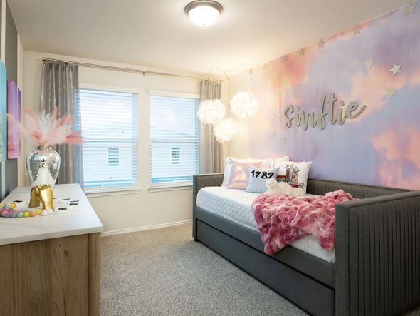 The Zilker floorplan includes two secondary bedrooms.