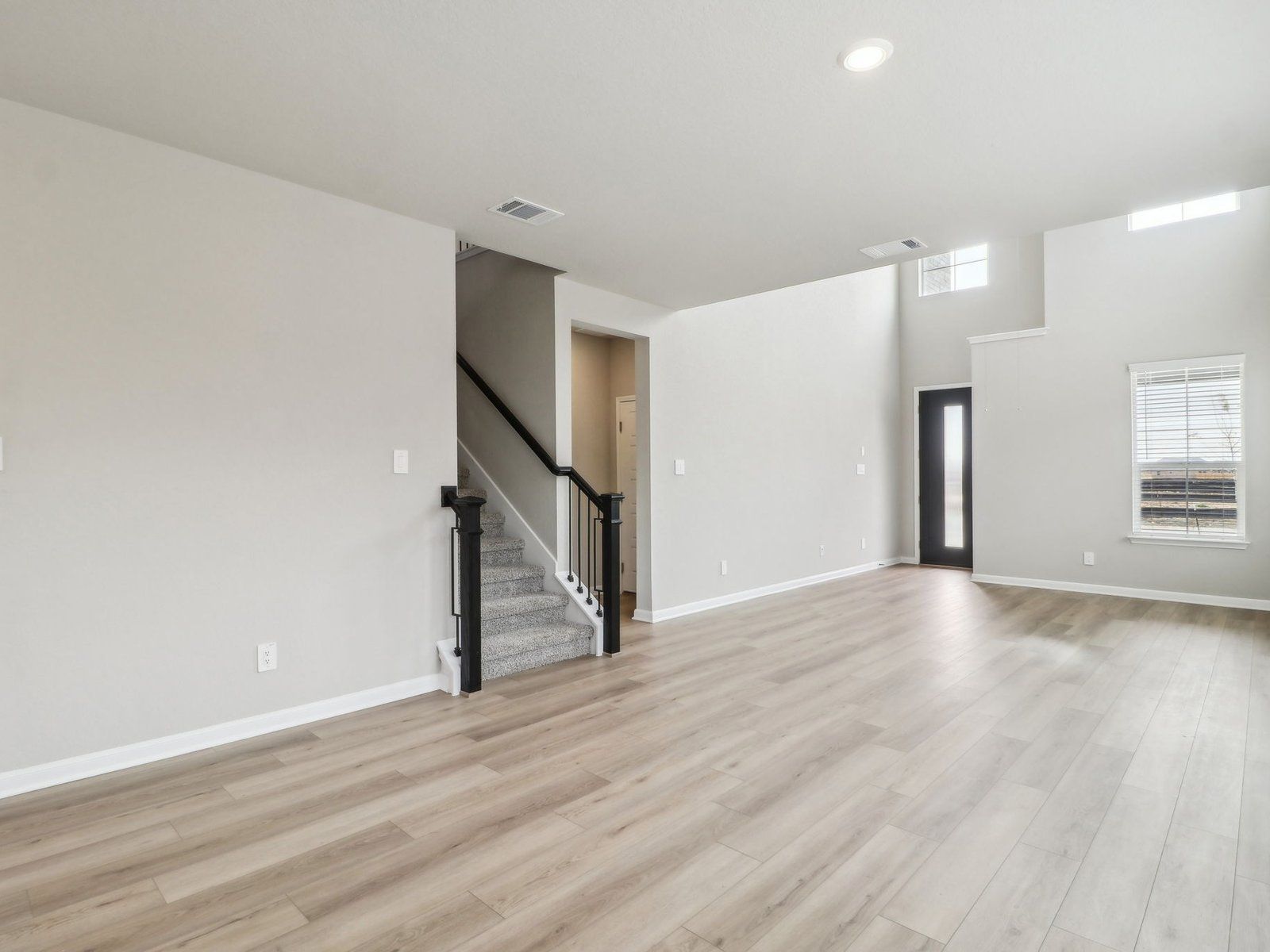 Living room in the Medina floorplan at a Meritage Homes community.