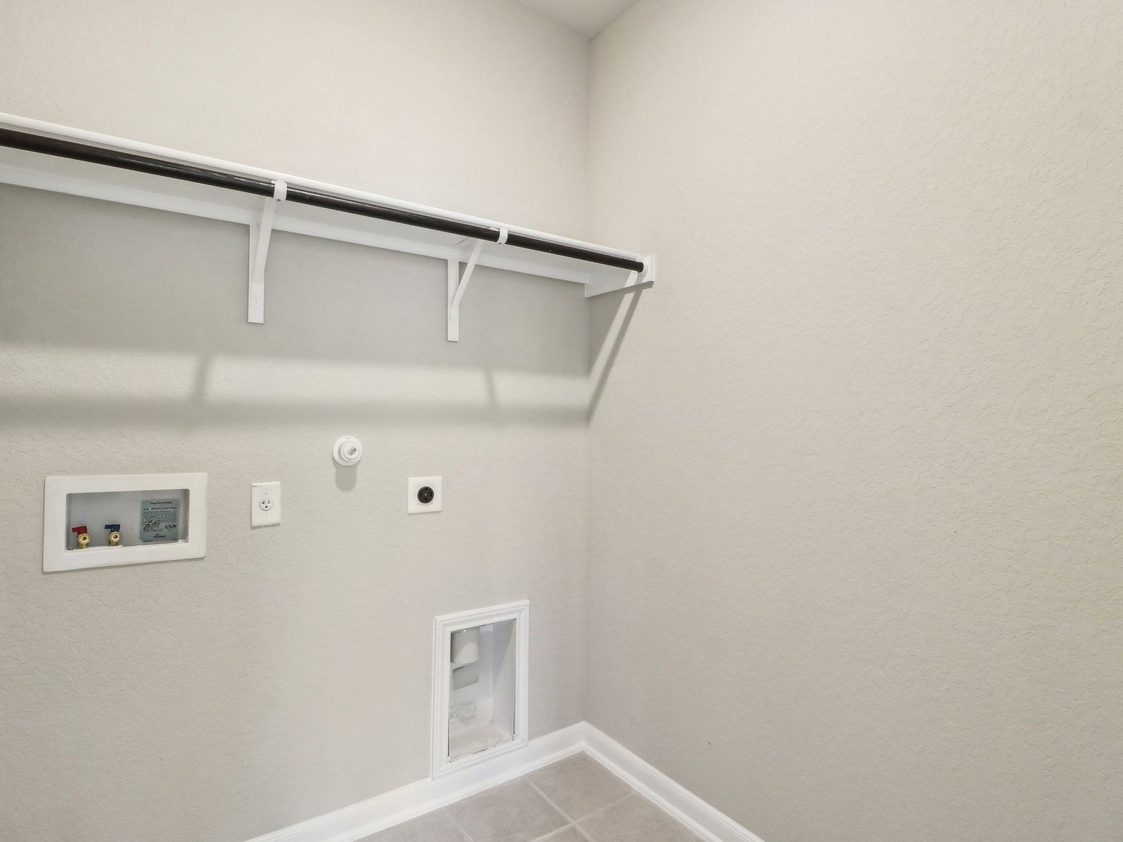 Laundry room in the Medina floorplan at a Meritage Homes community.