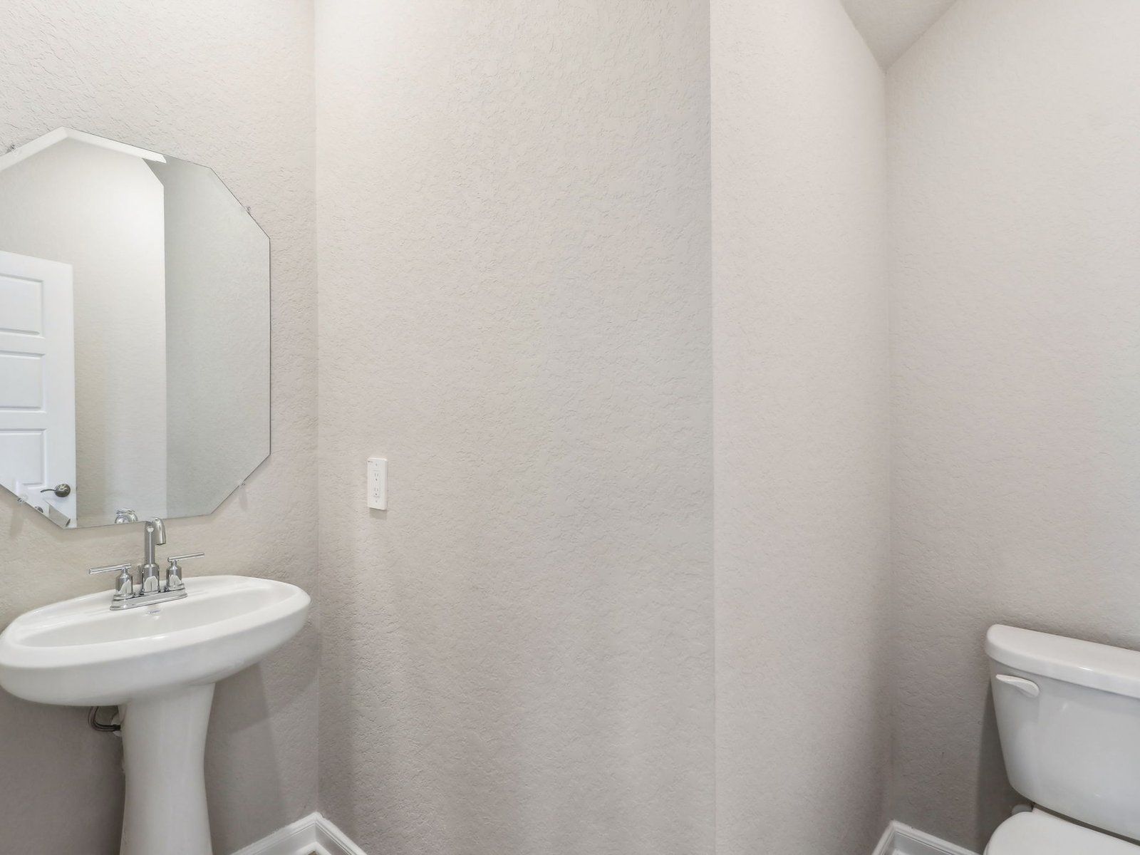 Powder room in the Medina floorplan at a Meritage Homes community.
