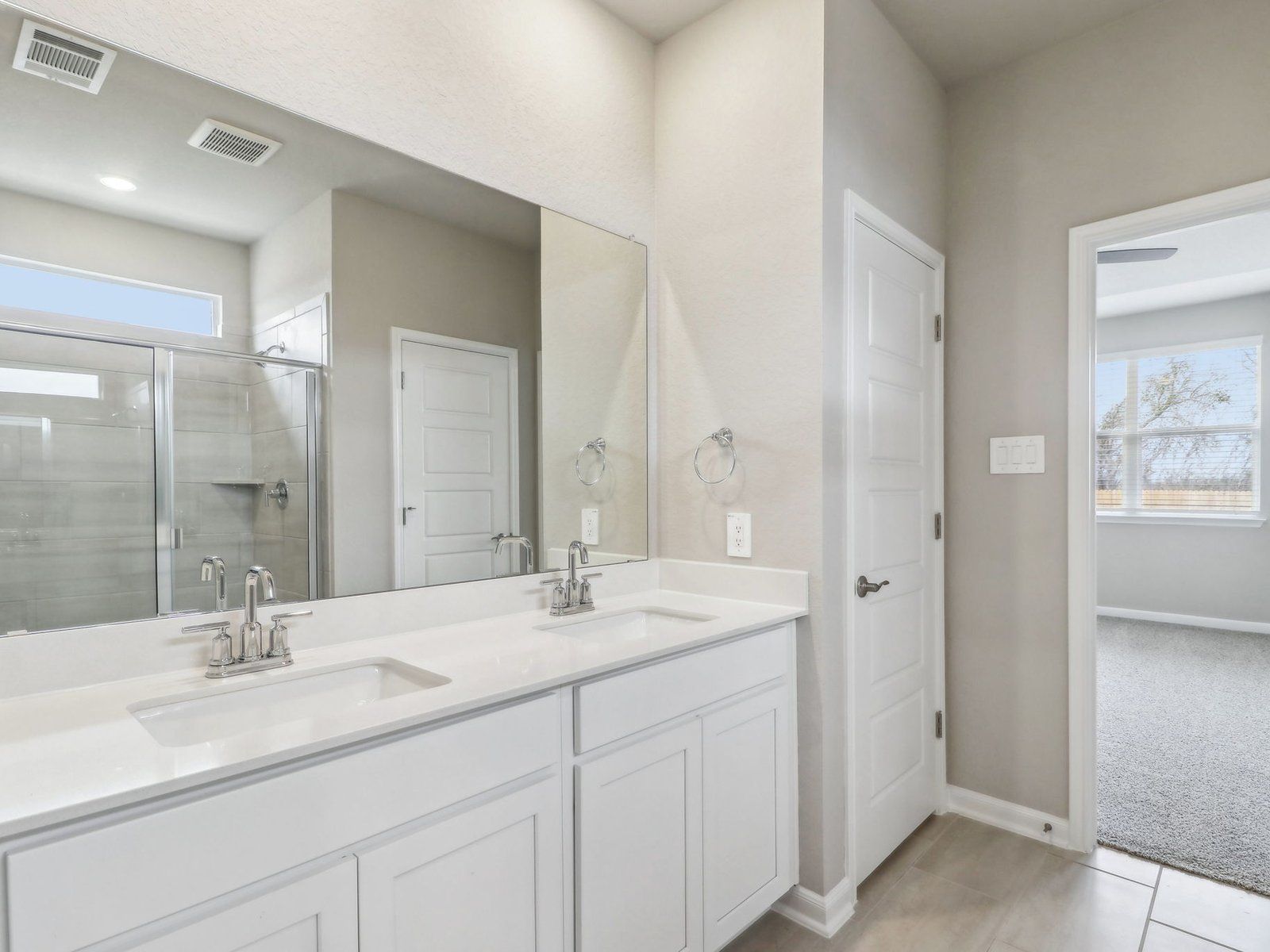 Primary suite bathroom in the Medina floorplan at a Meritage Homes community.