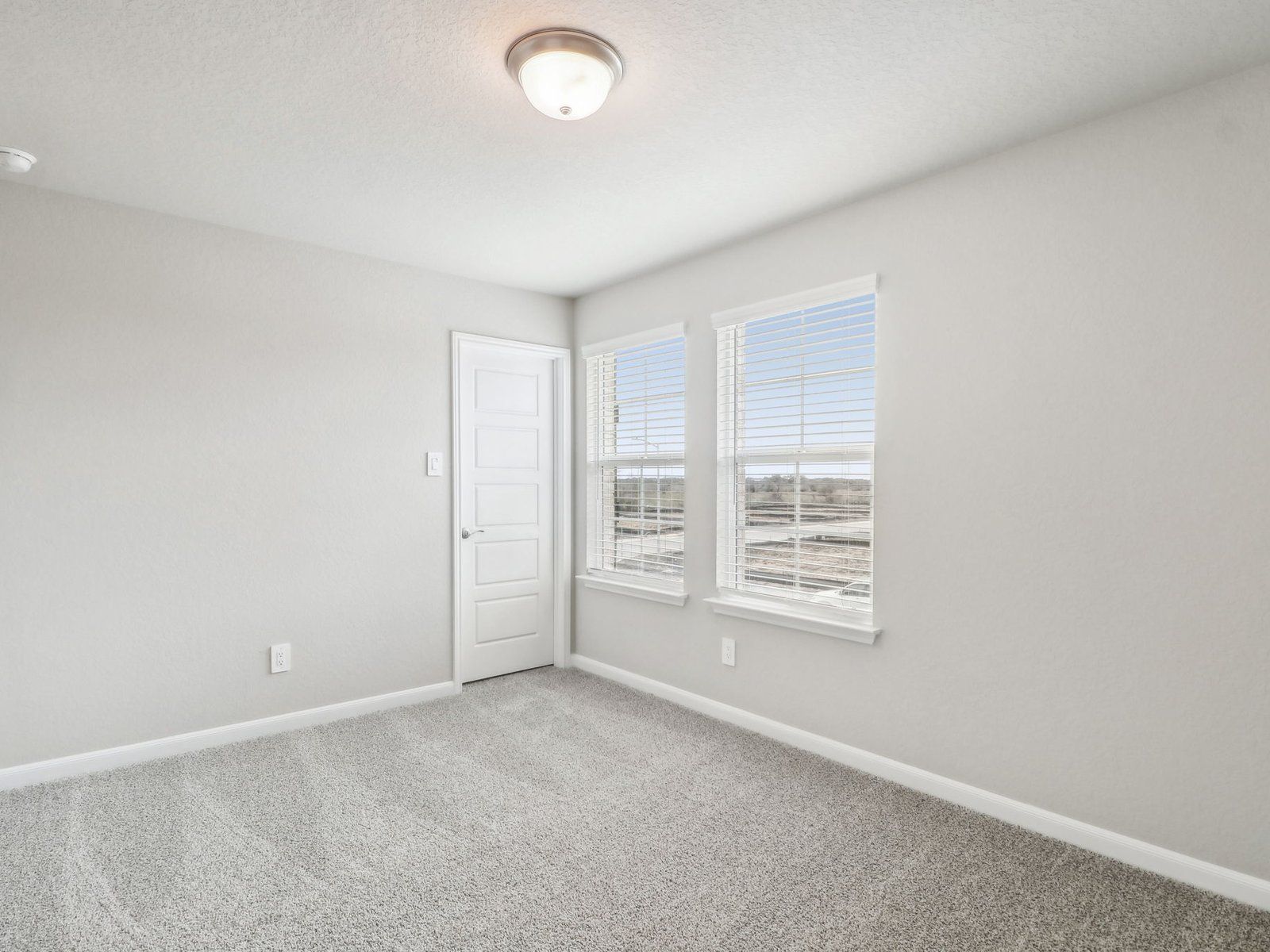 Guest bedroom in the Medina floorplan at a Meritage Homes community.