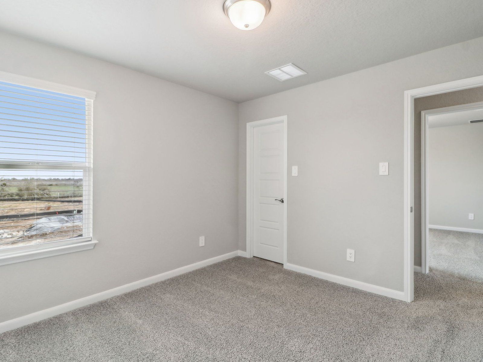 Guest bedroom in the Medina floorplan at a Meritage Homes community.