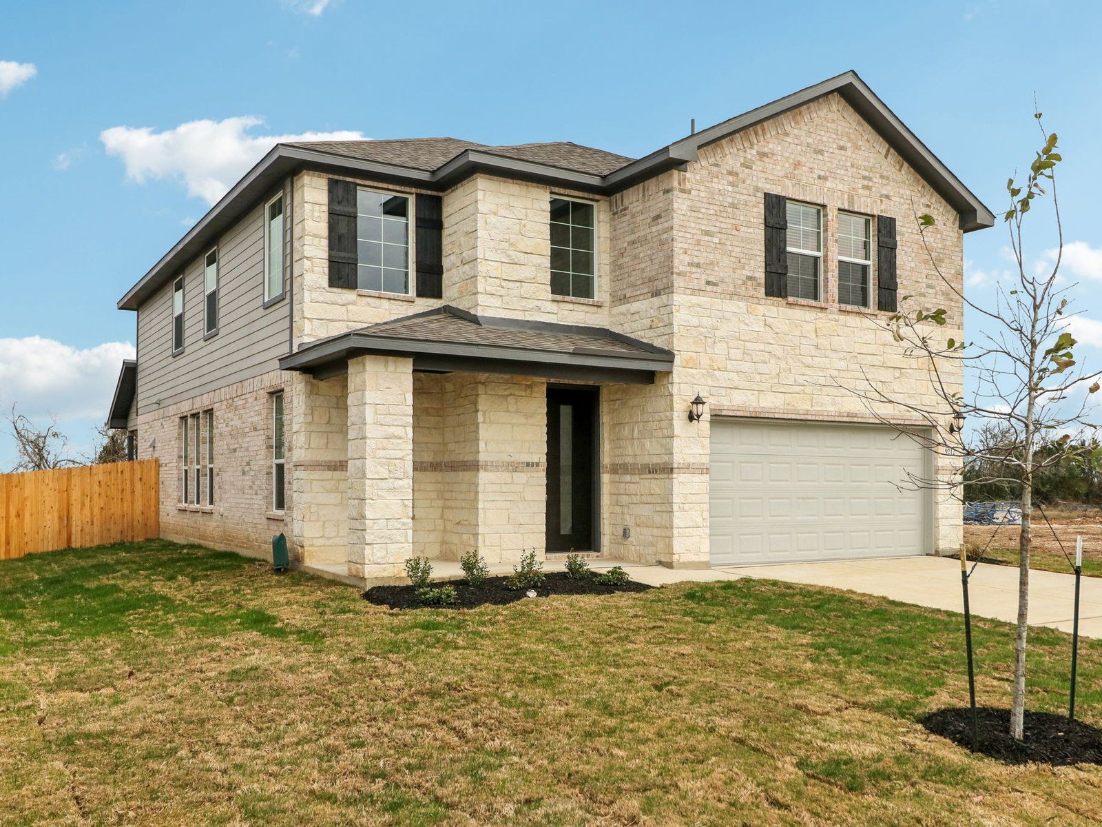 Front exterior of the Medina floorplan at a Meritage Homes community.