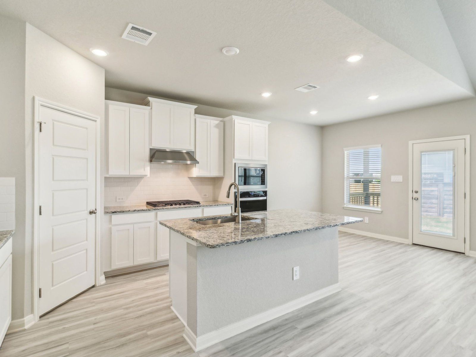SAN_Autry Pond_McKinnon_C451_Kitchen_18107 Ansley Path_017.jpg