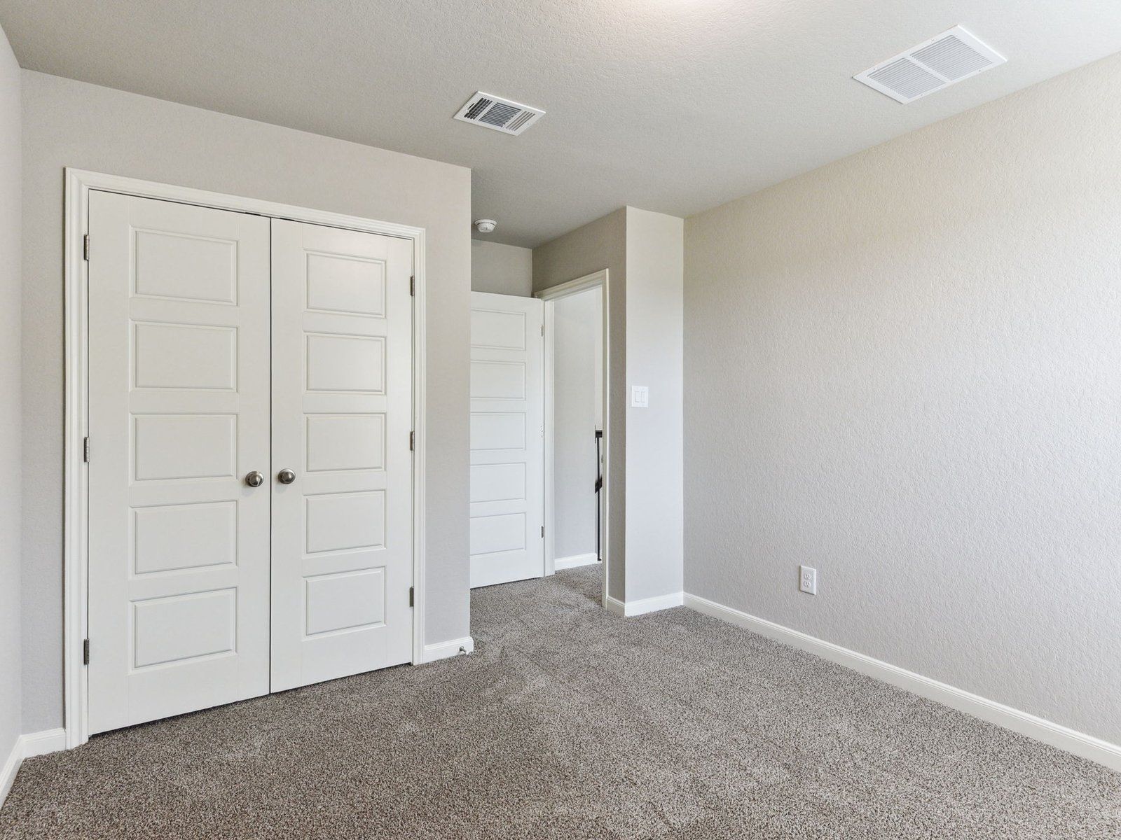 Guest bedroom in the Matador floorplan at a Meritage Homes community in San Antonio, TX.