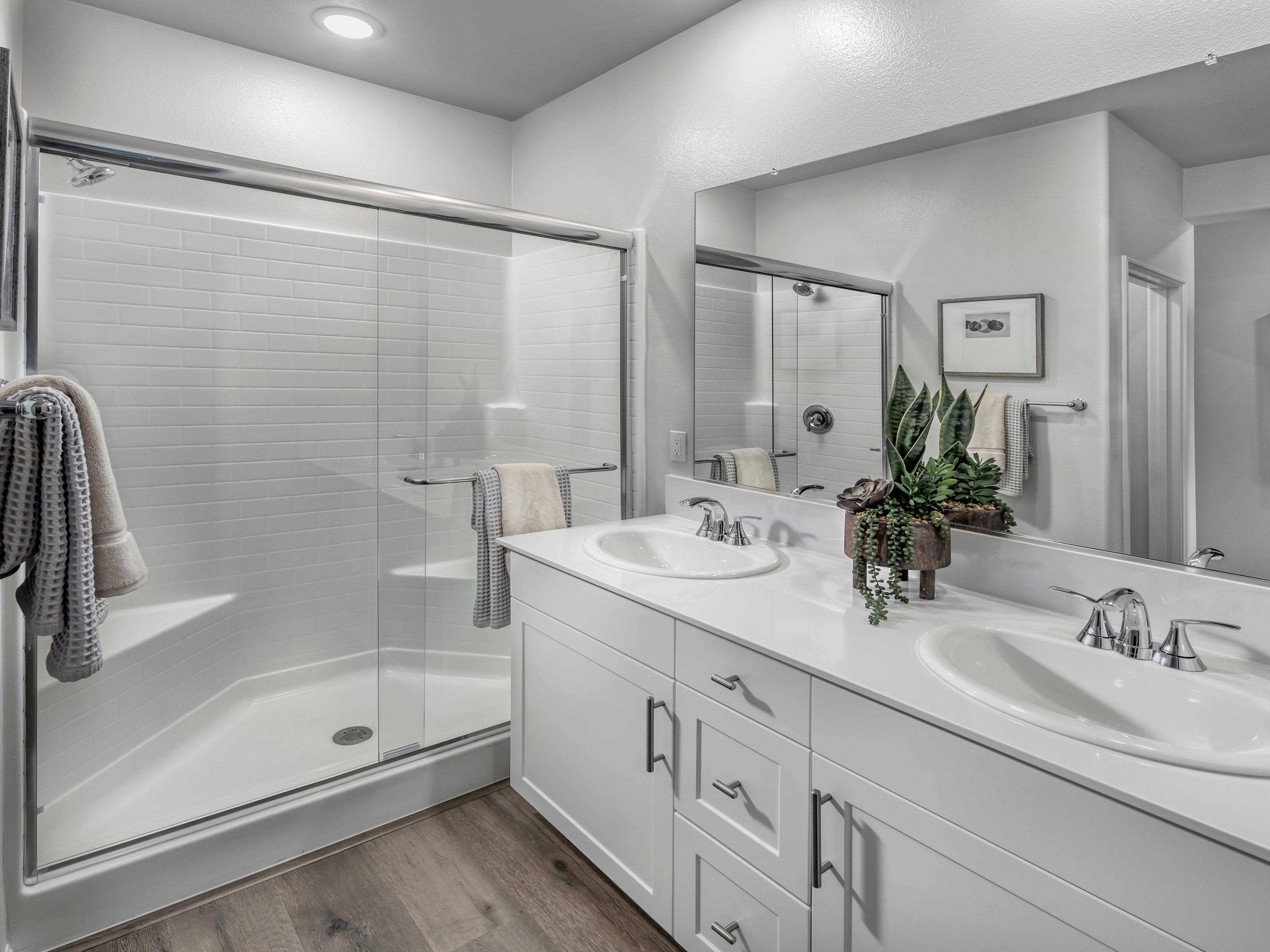 Start your day with ease in the spacious primary bathroom, designed for effortless mornings.