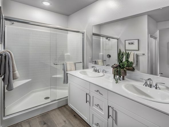Start your day with ease in the spacious primary bathroom, designed for effortless mornings.