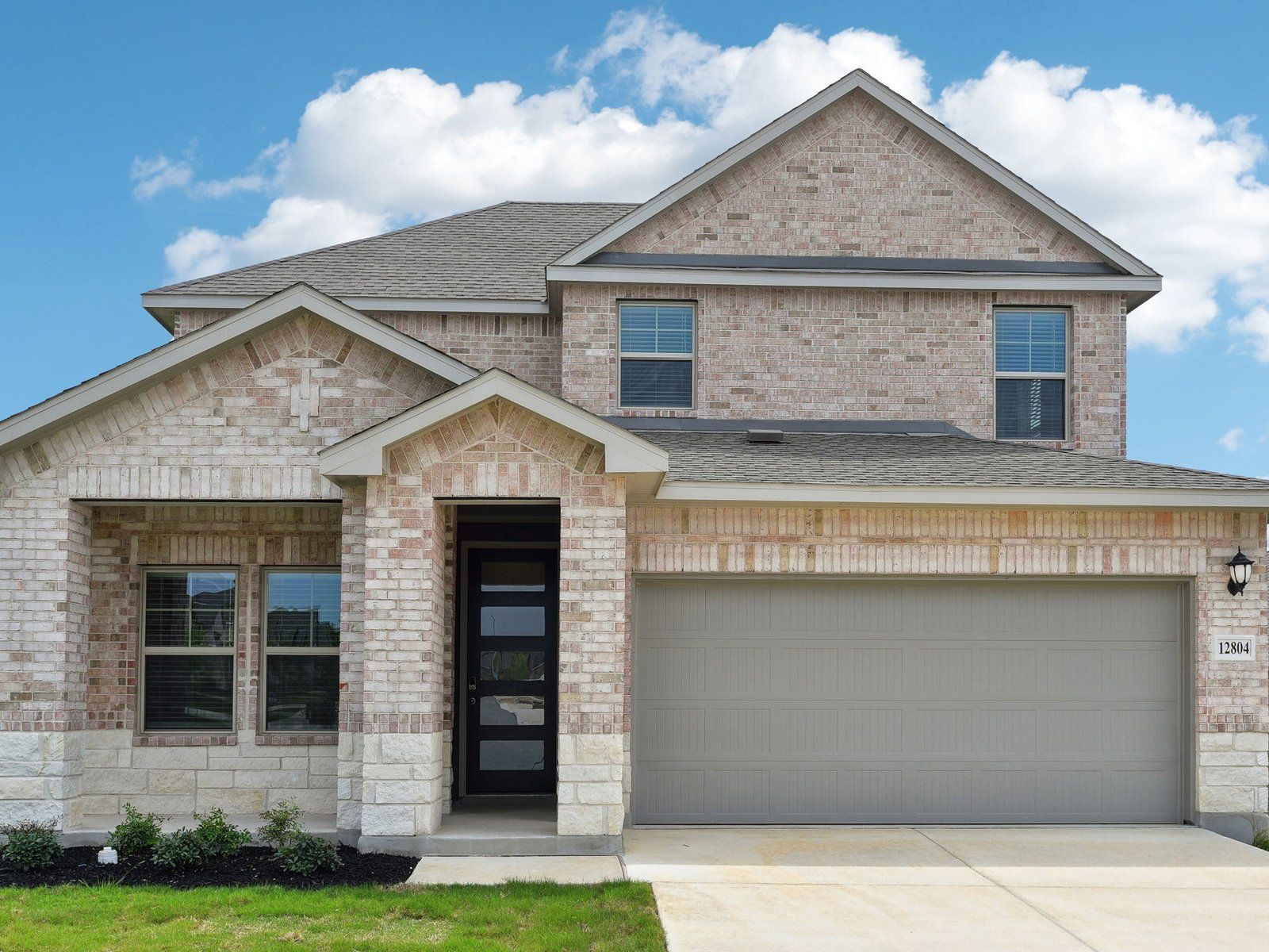 Front exterior of the Matador floorplan at a Meritage Homes community in San Antonio, TX.