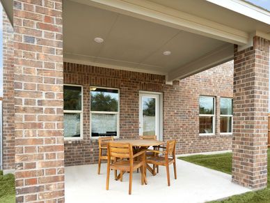 Enjoy the outdoors on the back patio of the Olympic