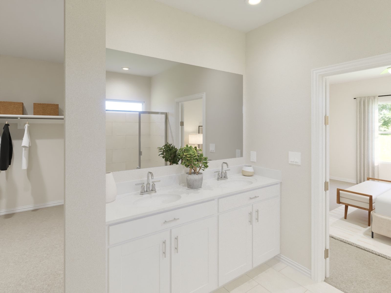 Primary bathroom with double vanity and large walk-in closet