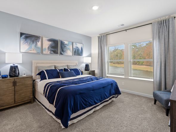 Relax and unwind in the spacious main-floor primary suite.