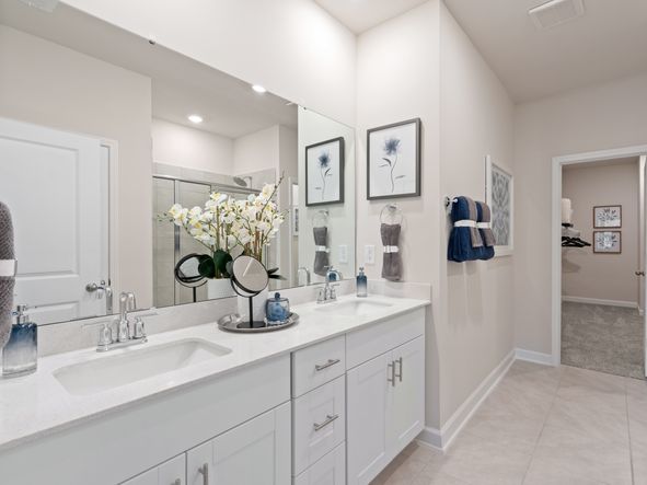 The primary suite boasts a private ensuite with dual sinks and large closet.