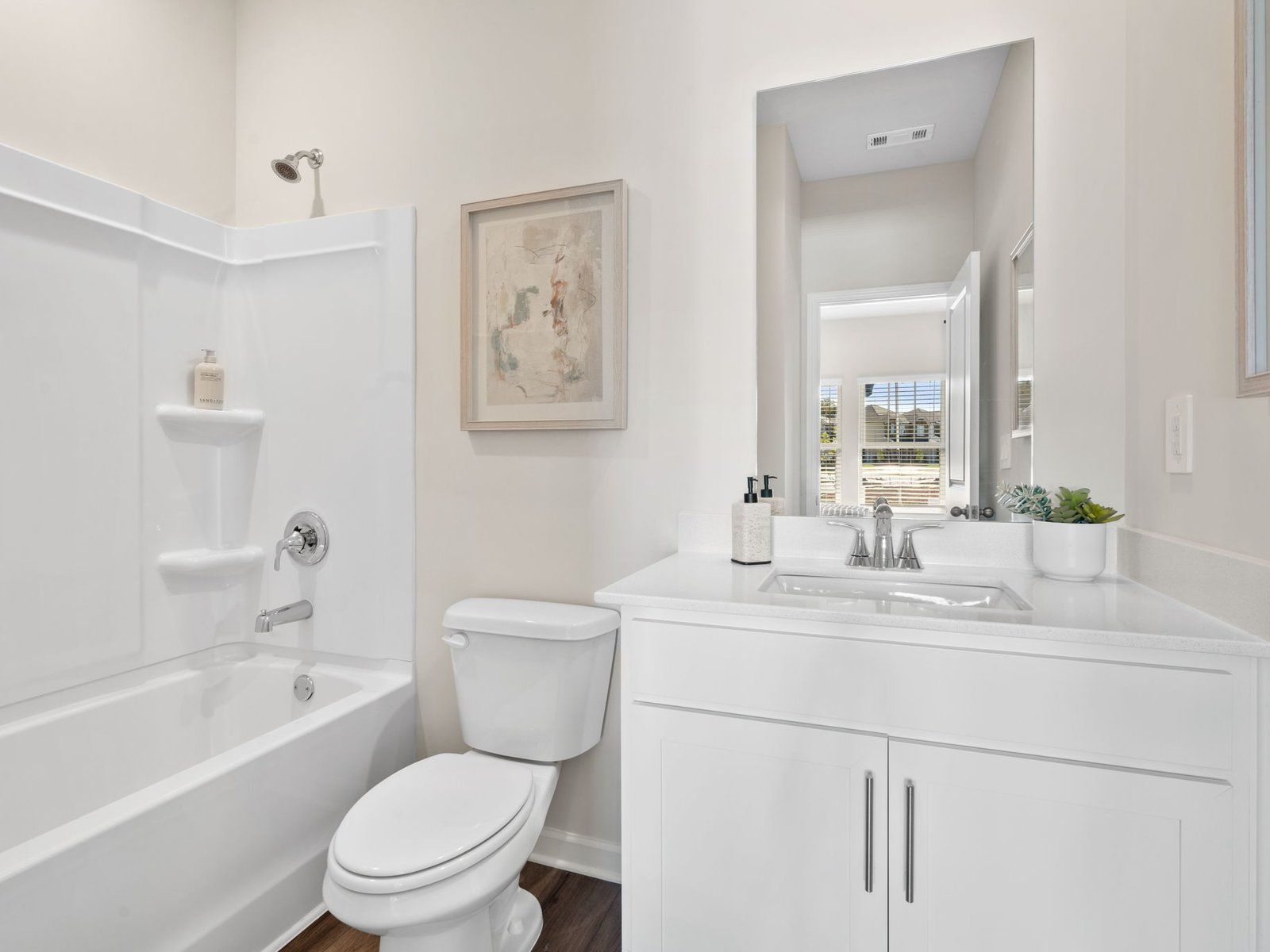 This secondary bathroom is perfect for guests and visitors.