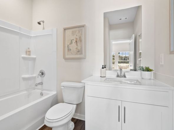 This secondary bathroom is perfect for guests and visitors.