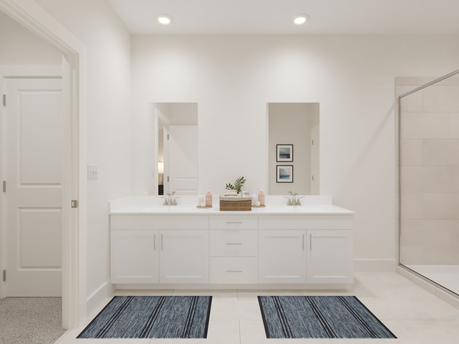 The primary bathroom offers dual vanity sinks and a walk-in shower.