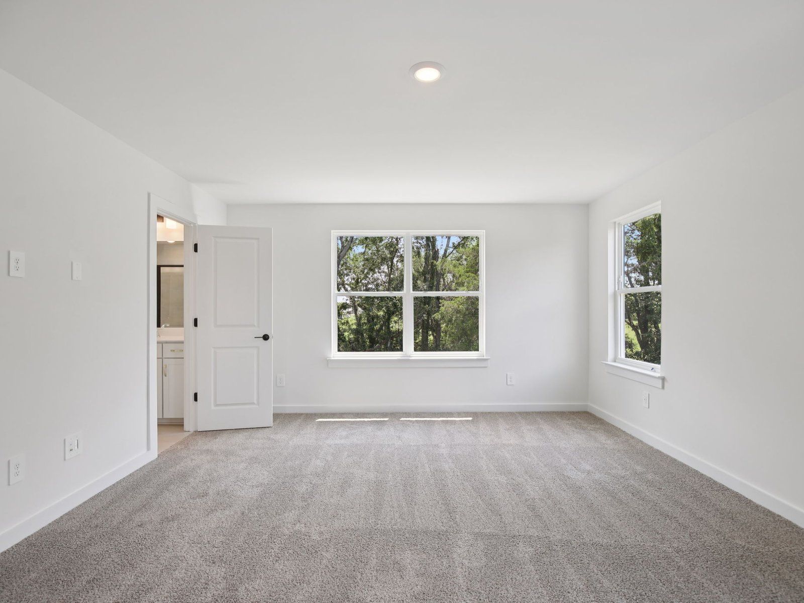 The primary suite offers a private retreat.