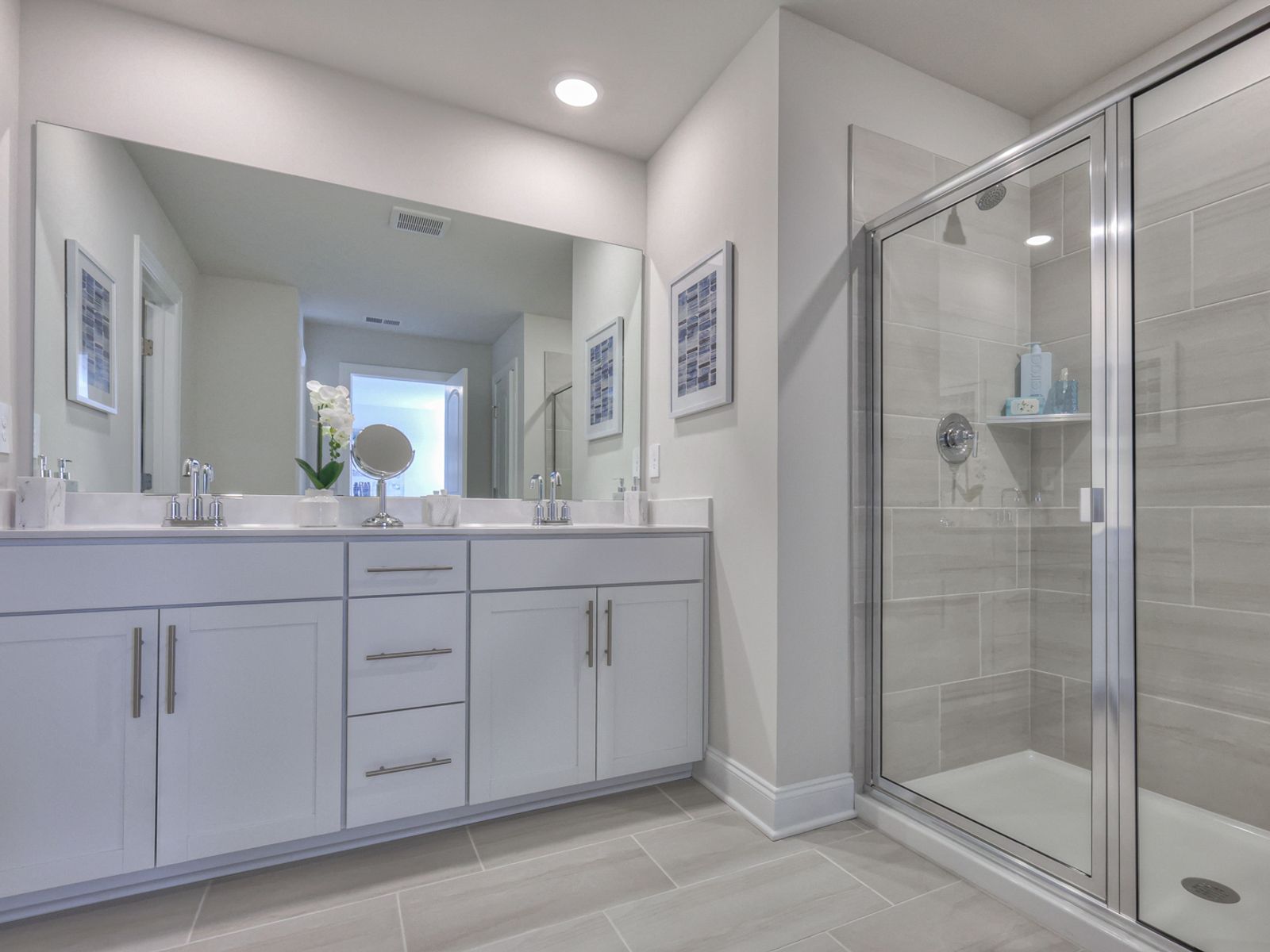 The primary bath offers dual vanity sinks and a walk-in closet.