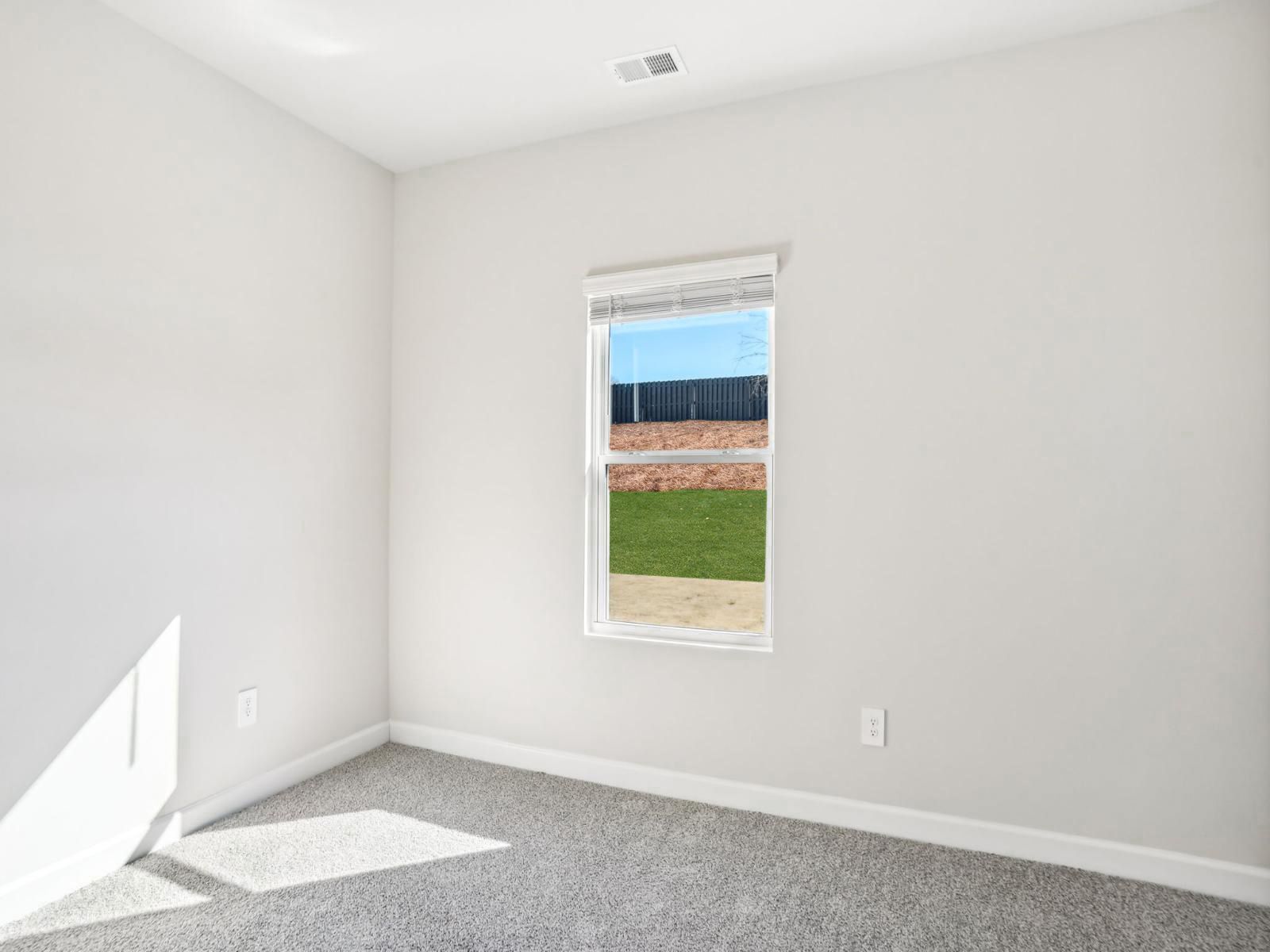 A secondary bedroom perfect for a home gym.