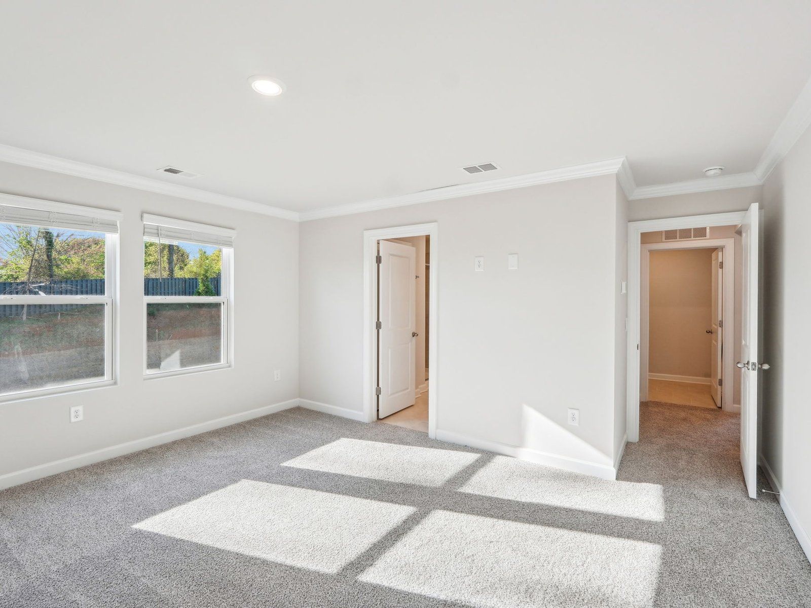 The primary bedroom connects to your own private en-suite.